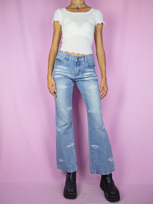 The Y2K Cyber Mid Rise Jeans are vintage mid-rise straight-leg denim pants with a slight flare and bleached details. These super cute jeans capture the style of the 2000s.