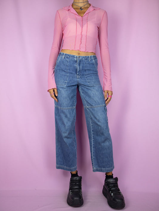 The Y2K Wide Cropped Jeans are vintage 2000s mid-rise cargo ankle denim pants with pockets and zipper closure.