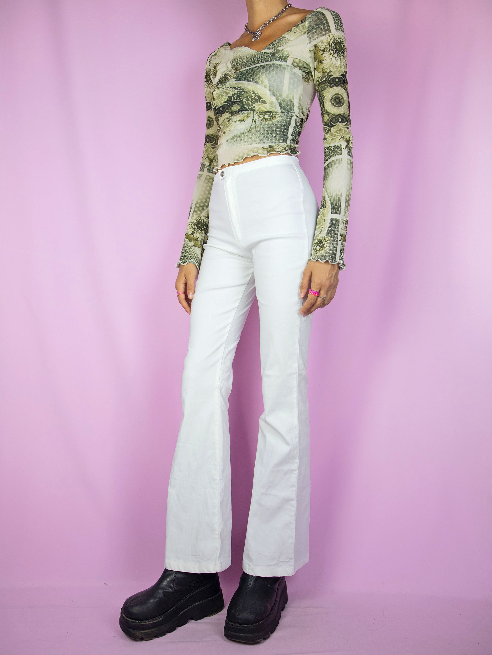The Y2K White Flare Pants are vintage 2000s stretchy high-waisted pants with a front zipper closure.