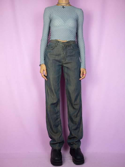 The Y2K Dark Rusty Straight Jeans are high-waisted straight-leg jeans with a dark rusted blue effect, featuring pockets and a front zipper closure. These pants embody a gorgeous cyber grunge gorpcore subversive style from the 2000s.