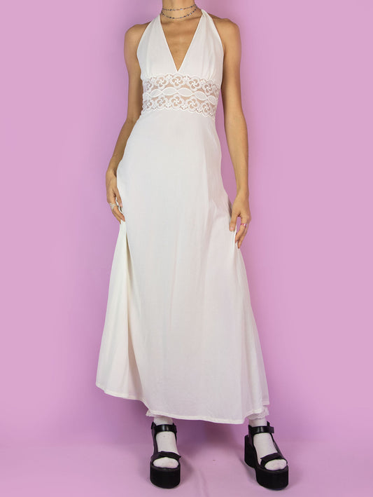The Vintage 70s White Halter Maxi Dress is an off-white open-back midi dress with lace details at the waist. Romantic lingerie 1970s boho slip night dress.