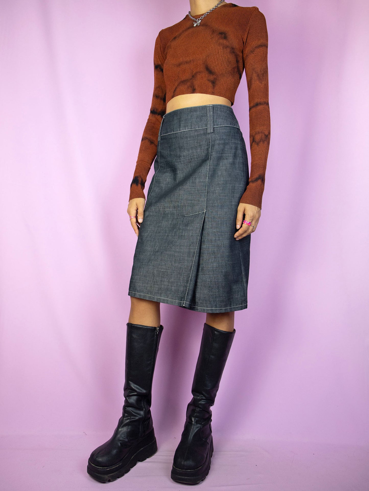 The Y2K Gray Denim Midi Skirt is a vintage skirt with a back zipper closure and front pleat detail. Cyber grunge 2000s subversive skirt.
