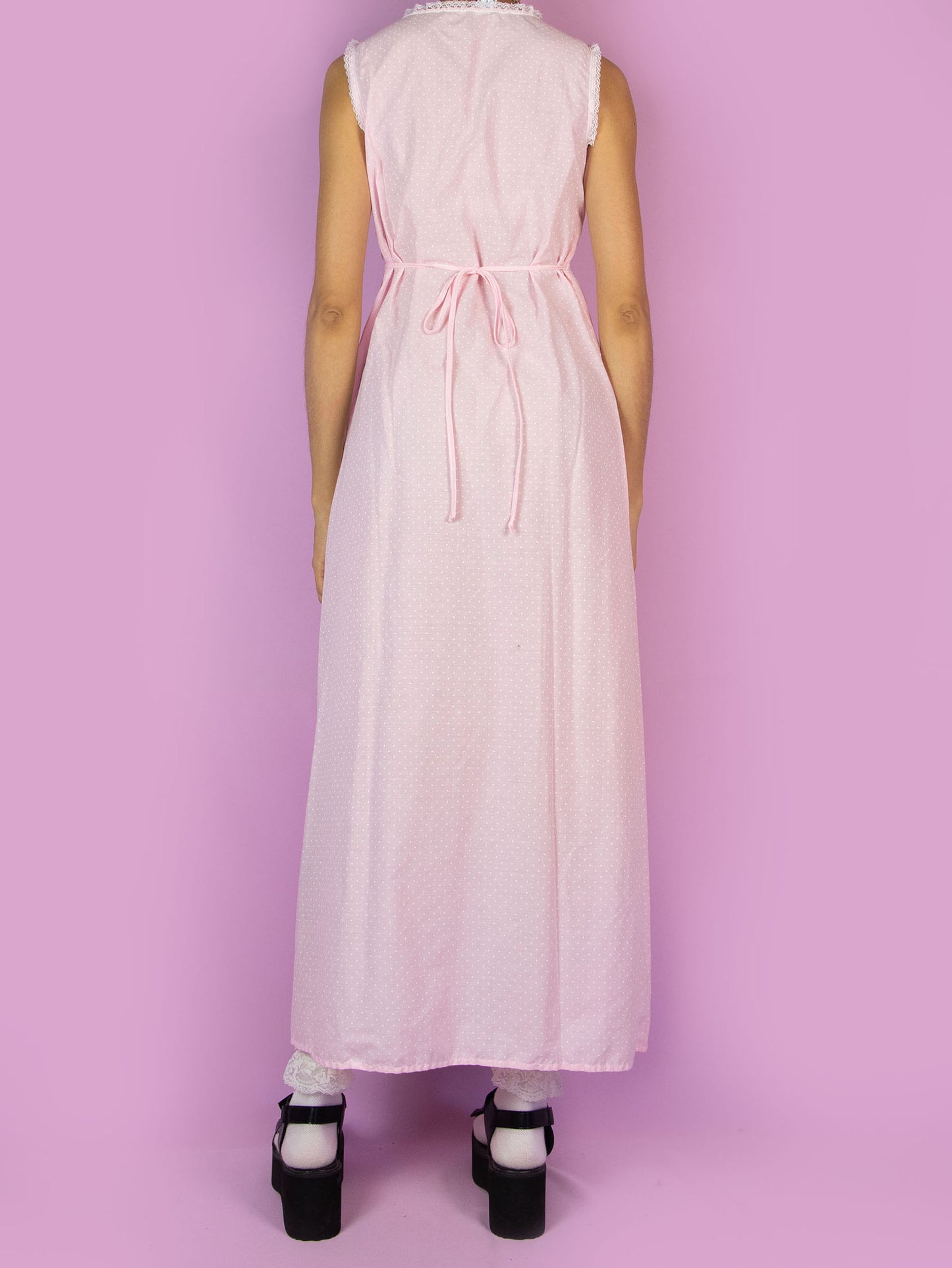 The Vintage 90s Pink Slip Maxi Dress is a light pastel pink polka dot midi dress featuring white lace details and ties at the back. Romantic 1990s night dress.