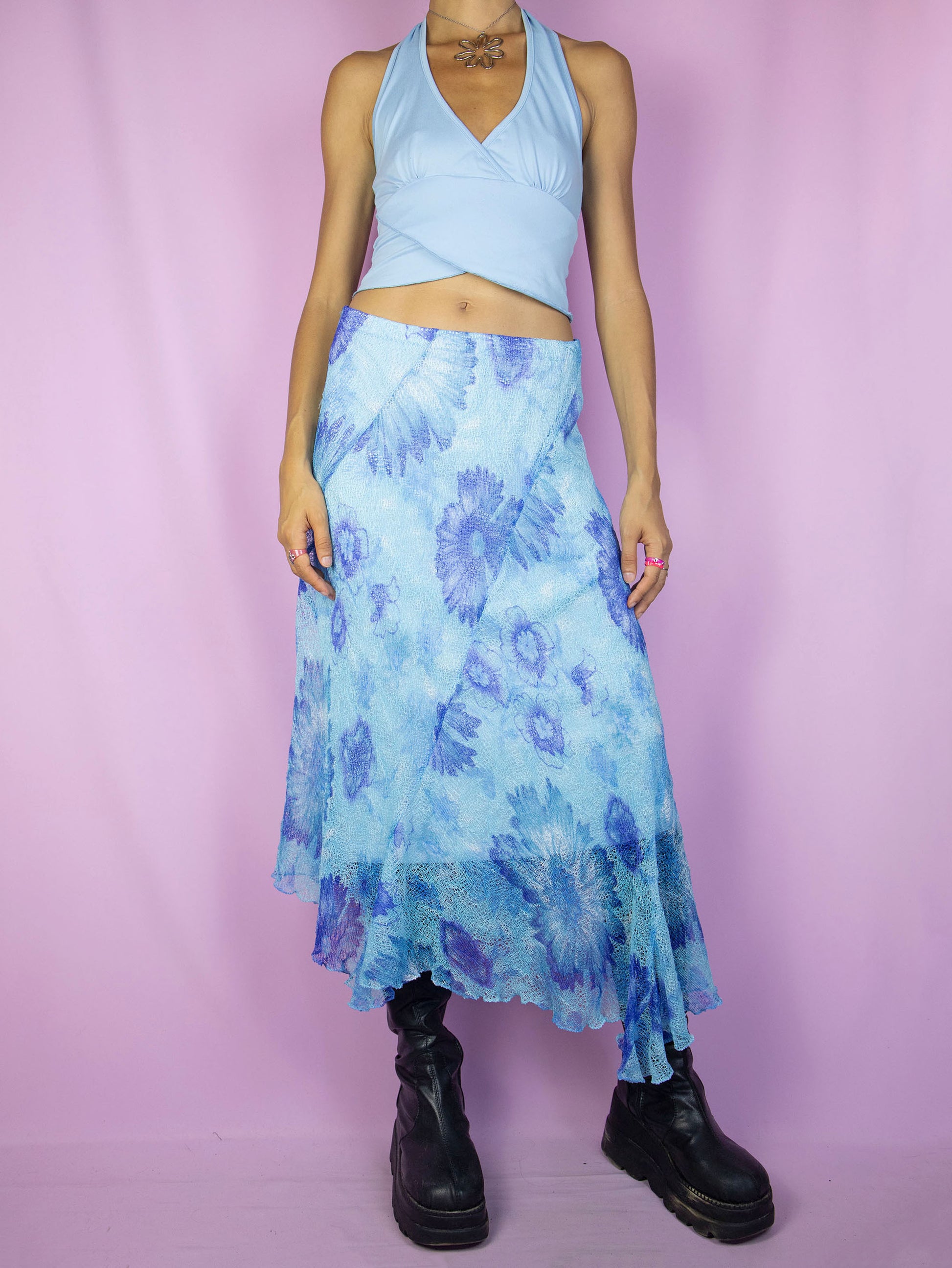 The Y2K Blue Mesh Midi Skirt is a vintage asymmetrical floral graphic skirt with an elastic waist. Boho fairy grunge 2000s summer maxi skirt.
