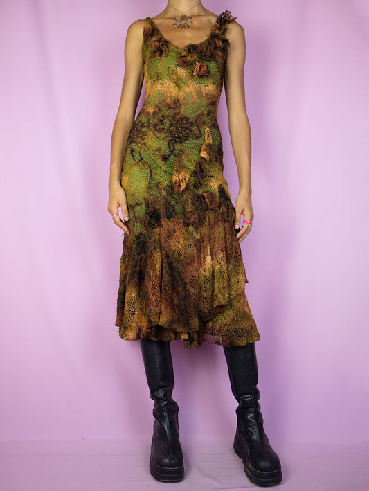 The Y2K Fairy Brown Midi Dress is a vintage sleeveless crochet-style mesh dress in brown with a tie-dye effect and a green lining. It features a layered ruffled hem, and a charming asymmetric design. A stunning romantic avant-garde fairy grunge party dress from the 2000s.