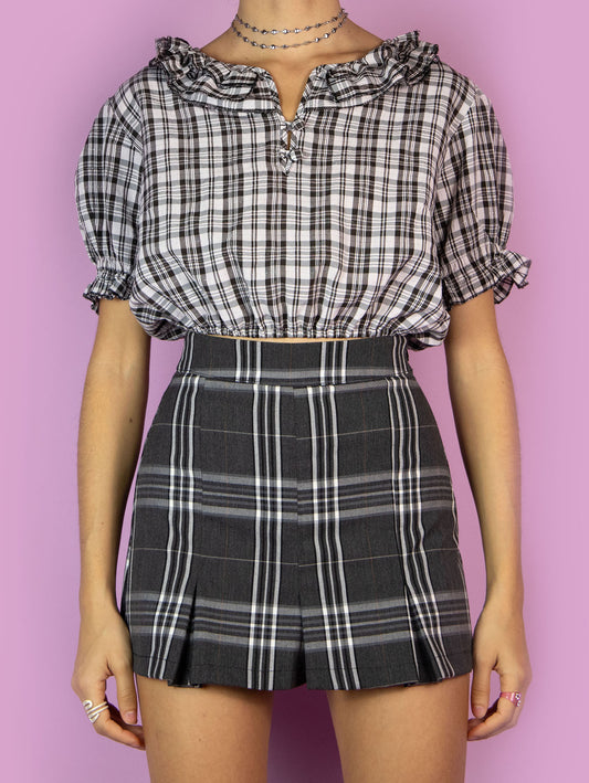 The Vintage 90s Ruffle Plaid Crop Top is a black and white check shirt with puff sleeves and buttons at the neck. Cottage prairie 1990s summer milkmaid gingham top.