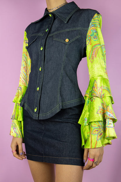 The Vintage Y2K Bell Sleeve Denim Jacket is a dark denim jacket adorned with paisley floral print green bell sleeves, featuring stylish ruffles. This cyber statement jacket hails from the fashion era of the 2000s.