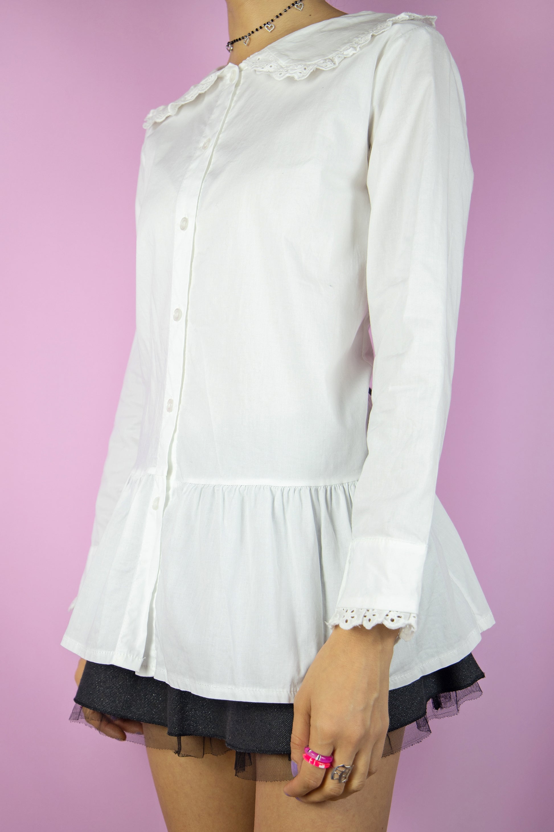 The Y2K White Big Collar Blouse is a vintage oversized collar shirt with buttons, ruffle hem, and lace trim. Cottage prairie 2000s preppy office coquette blouse.