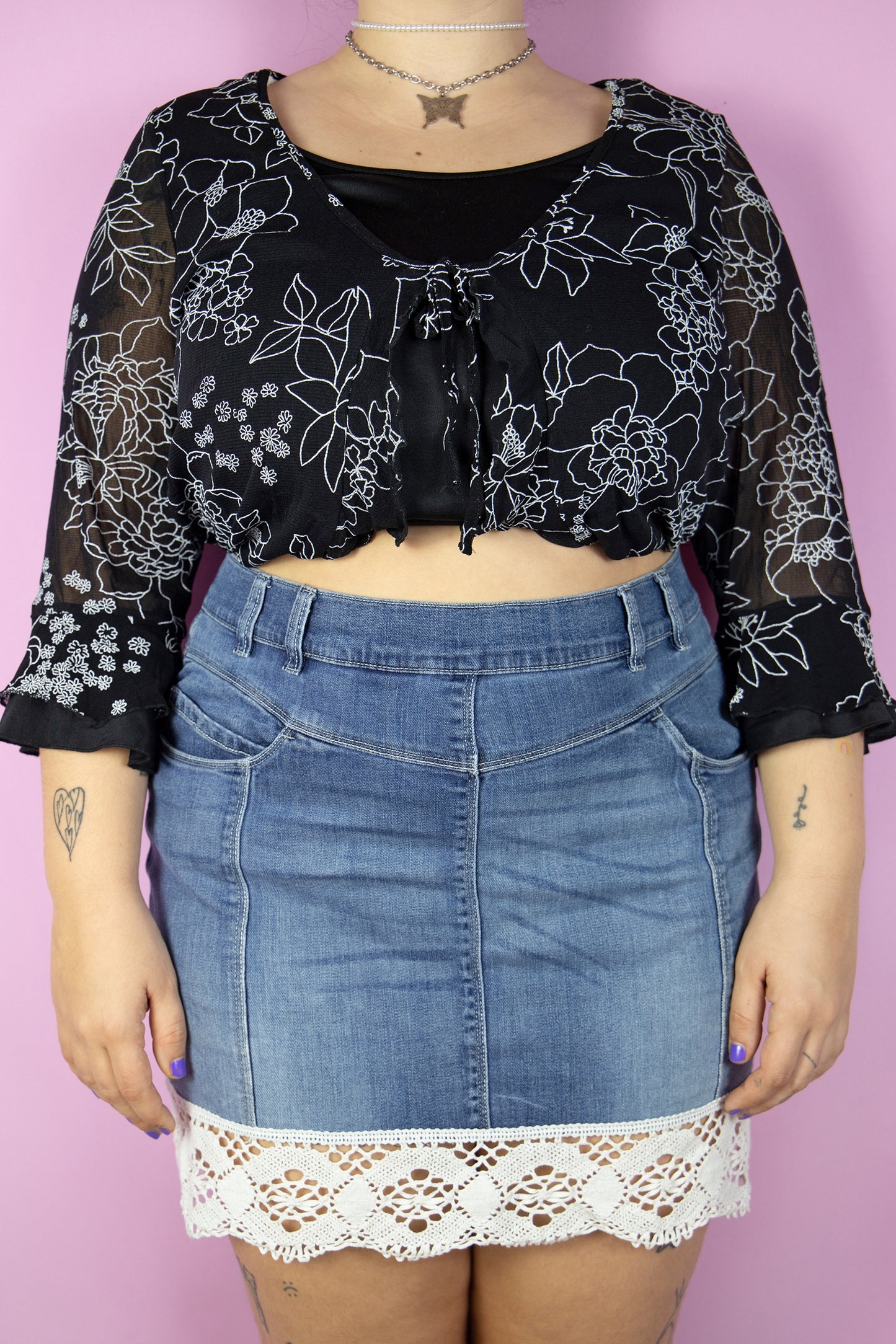 The Y2K Boho Denim Mini Skirt is a vintage stretchy skirt adorned with white crochet lace trim. Cyber 2000s summer jean mini skirt.