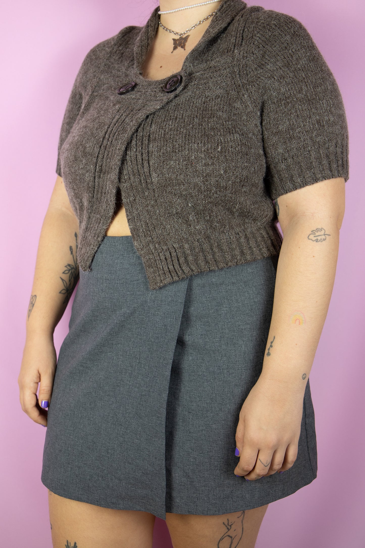 The Y2K Brown Knit Bolero Shrug is a vintage short-sleeved cropped cardigan with a two-button closure. Made from a blend of wool and mohair. Boho fairy grunge 2000s knitted bolero jacket.