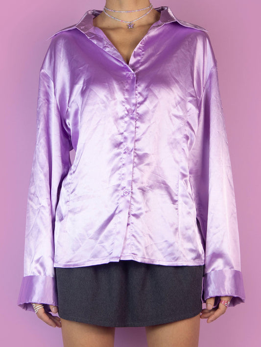 The Y2K Lilac Satin Blouse is a vintage bright pinkish-purple shirt with a collar and buttons. Elegant preppy 2000s office work blouse.