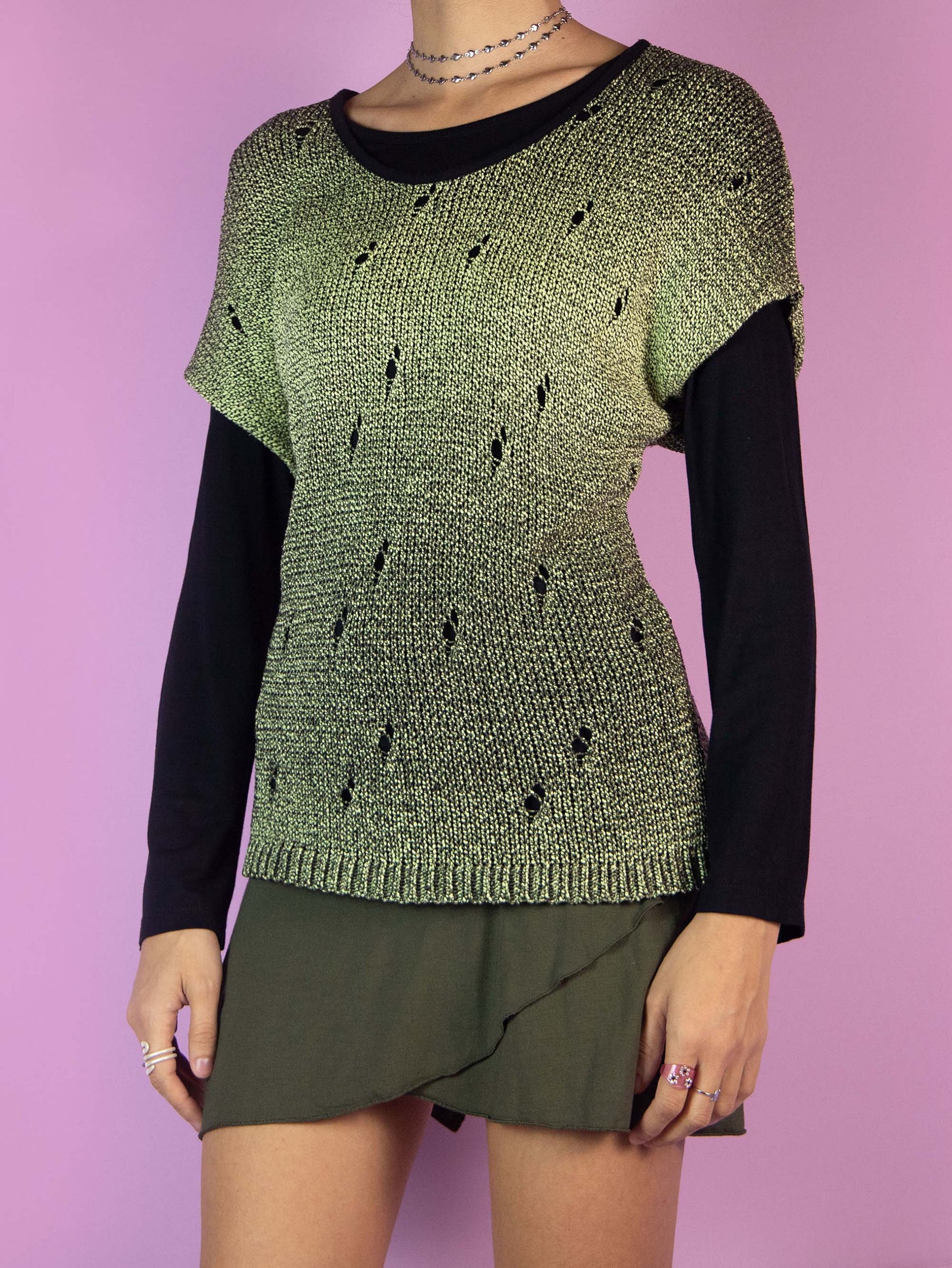 The Y2K Subversive Grunge Knit Top is a vintage long-sleeved double-layer black and green shirt. Cyber goth 2000s distressed crochet sweater.