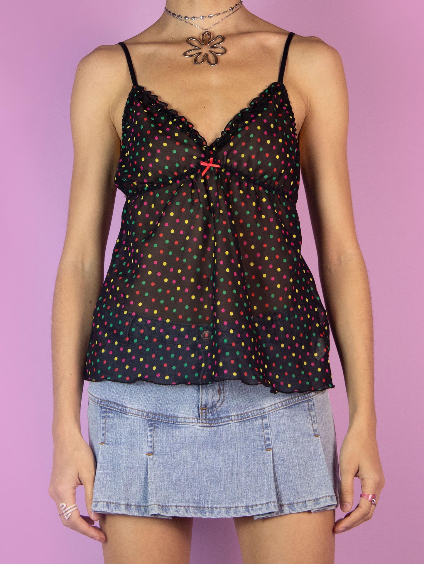 The Y2K Black Sheer Cami Top is a vintage semi-transparent camisole with a multicolored polka dot pattern, V-neckline, and adjustable straps. Romantic coquette 2000s tank top.