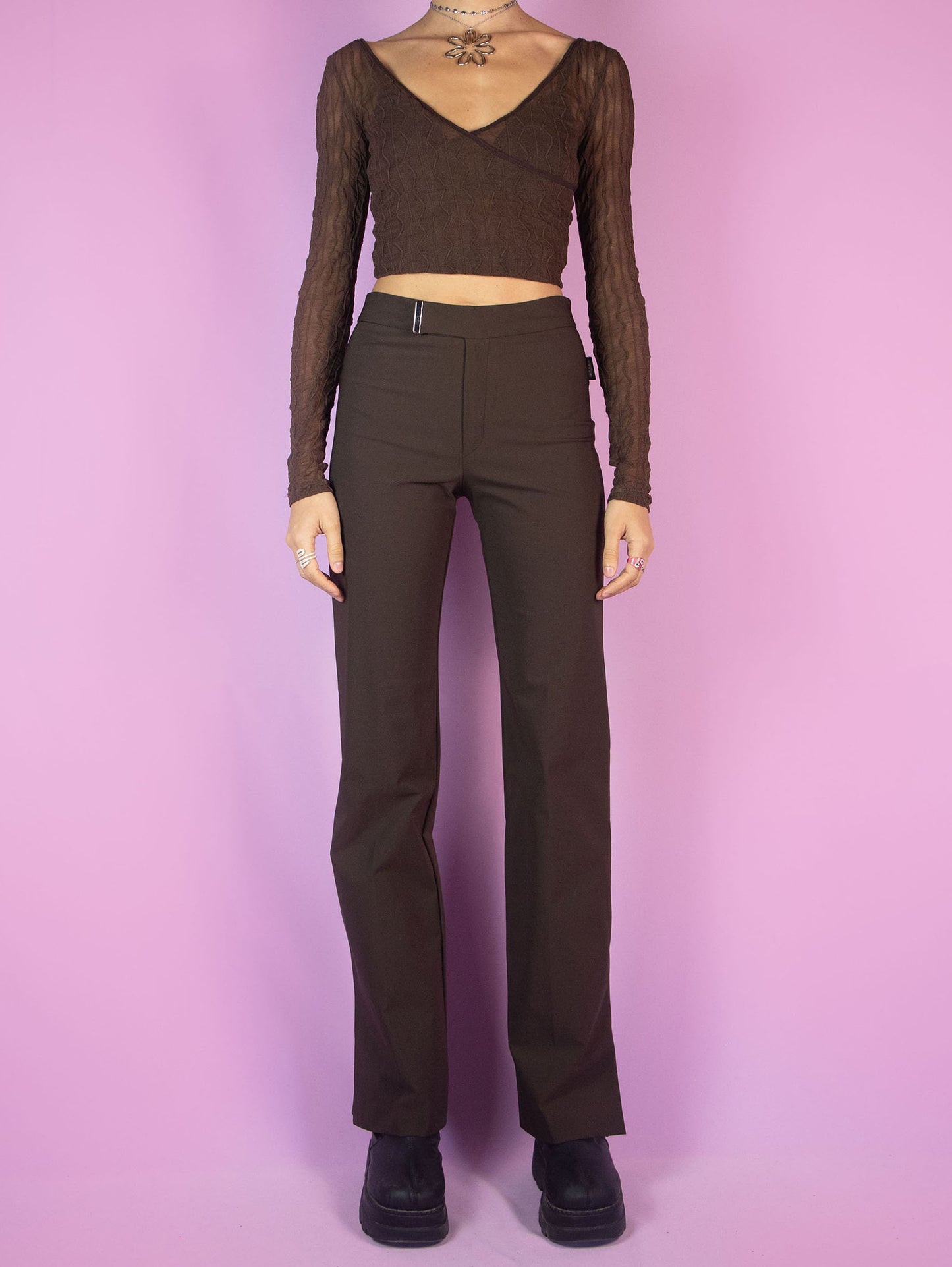 The Y2K Brown Wide Pants are vintage straight pants with elastic fabric, featuring a zipper closure and slits at the hem. Cyber grunge 2000s trousers.