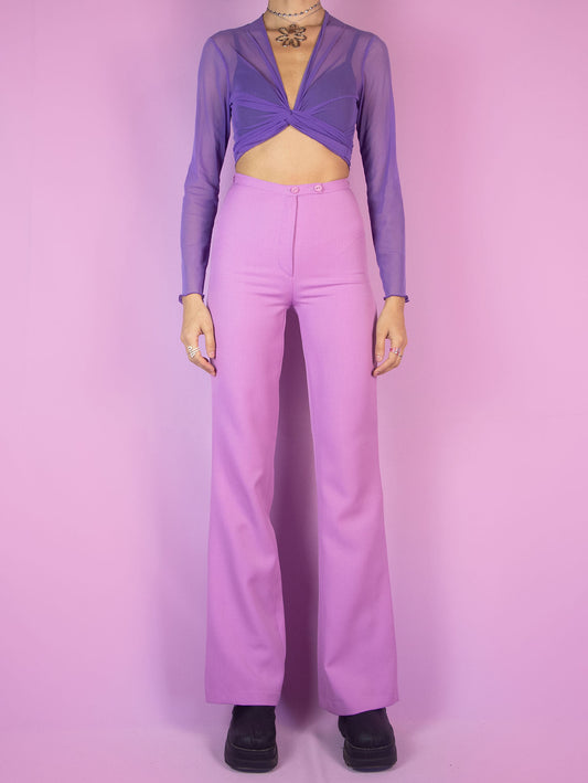 The Vintage 90s Pink Tailored Wide Pants are light pastel lilac high-waisted pants with a zipper closure and slits at the hem. Elegant evening party 1990s classic pleated trousers.