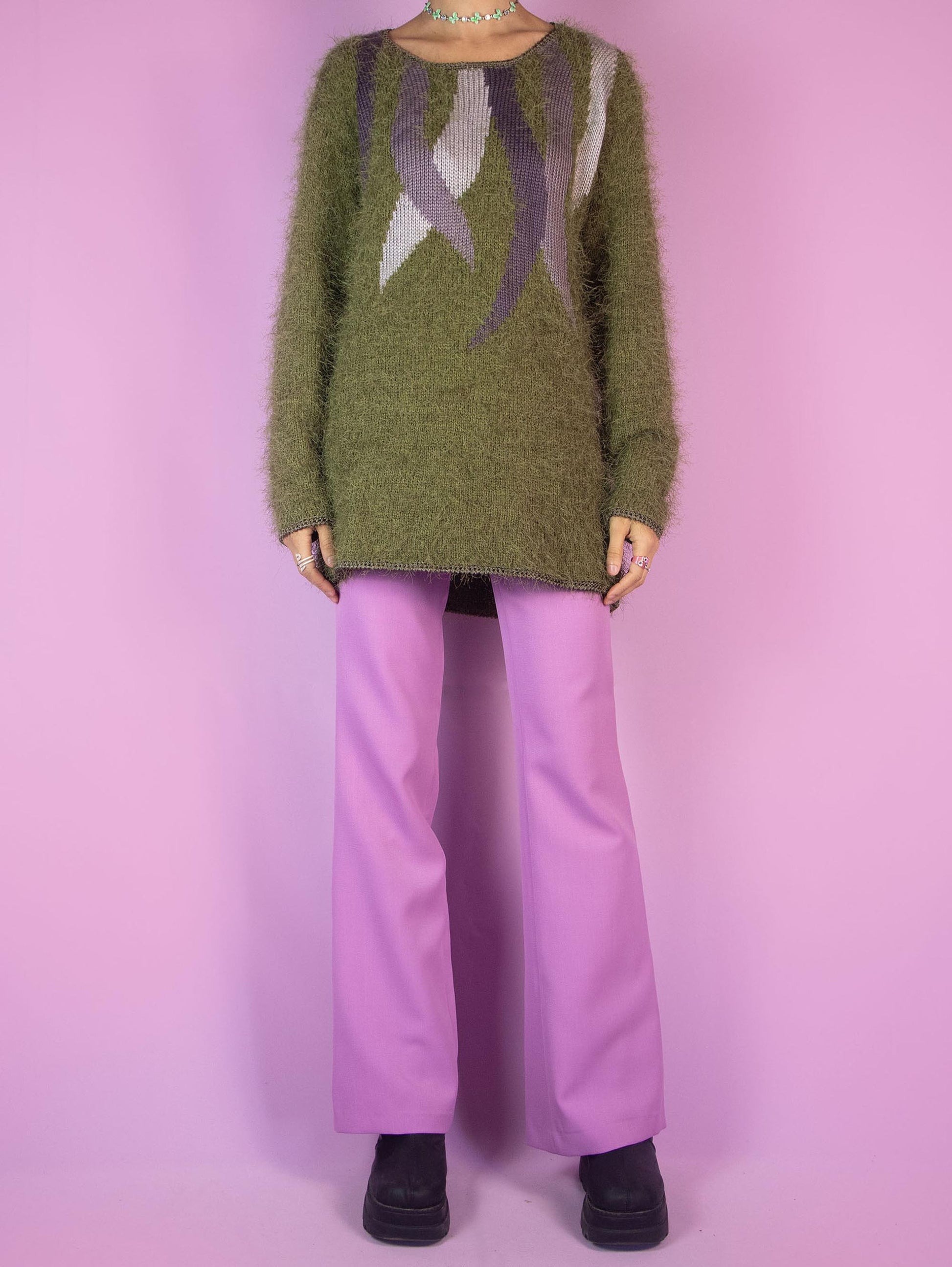 The Vintage 90s Green Hairy Knit Sweater is a khaki pullover with abstract purple details. Boho retro 1990s knitted jumper.