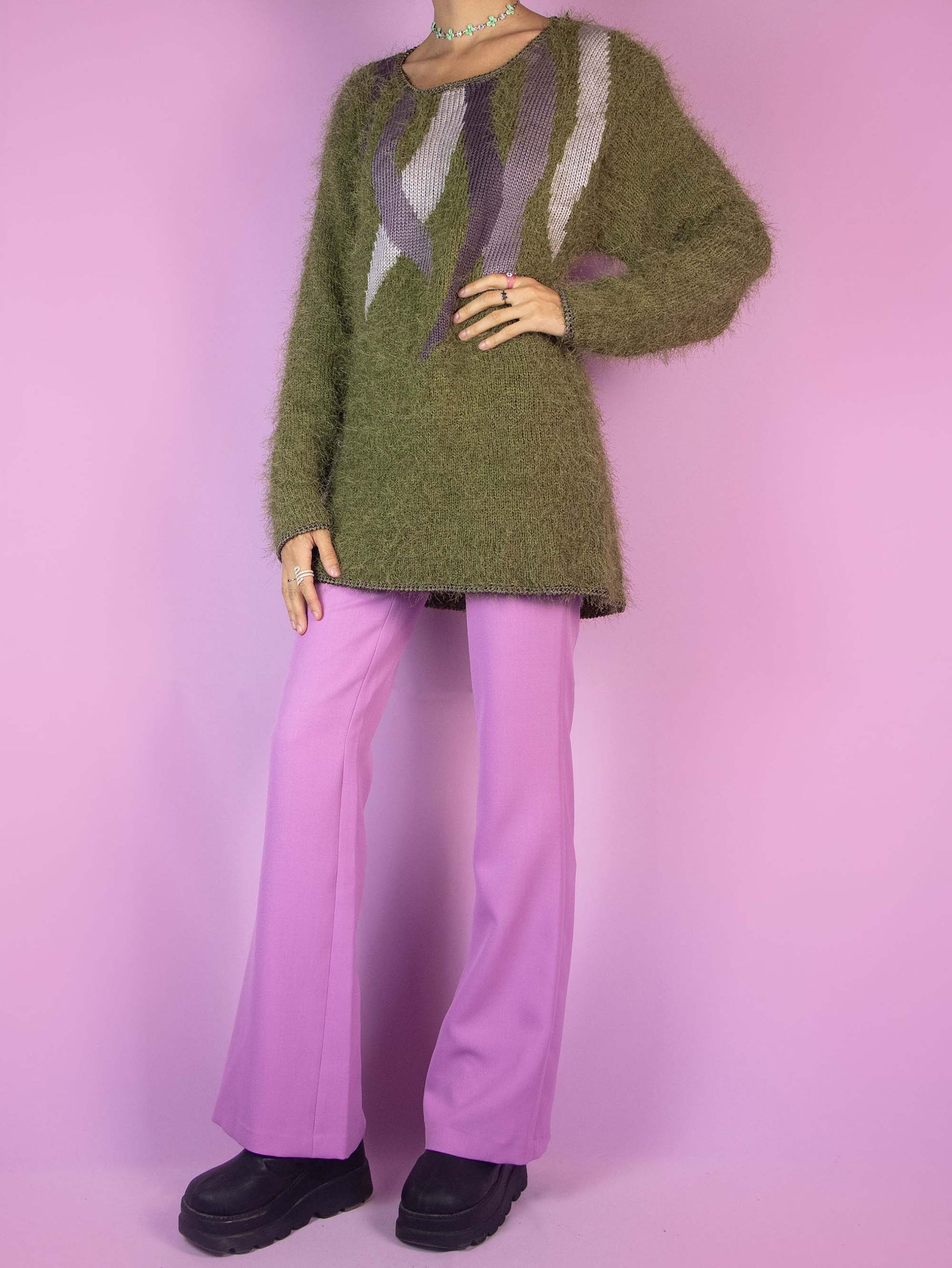 The Vintage 90s Green Hairy Knit Sweater is a khaki pullover with abstract purple details. Boho retro 1990s knitted jumper.