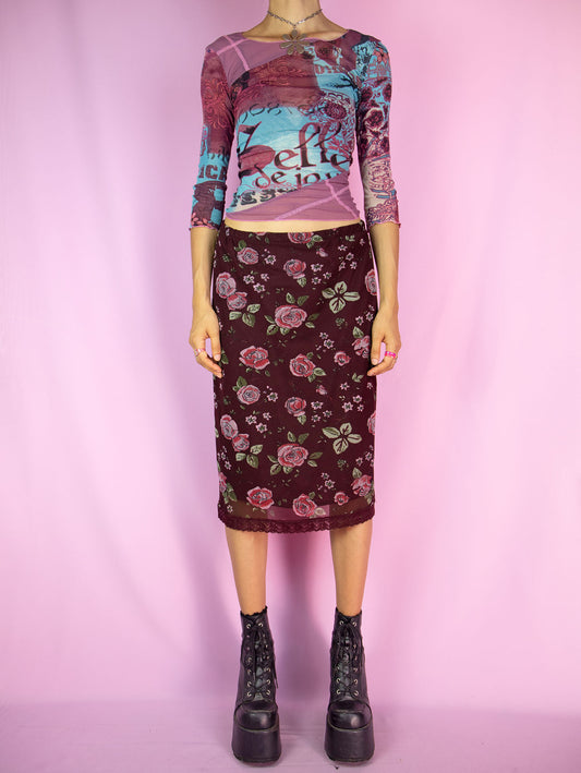 The Vintage Y2K Floral Mesh Midi Skirt showcases a beautiful burgundy rose floral print mesh with delicate lace detailing and an elasticated waist. Step into the fairy grunge vibes with this charming summer mini skirt from the 2000s.