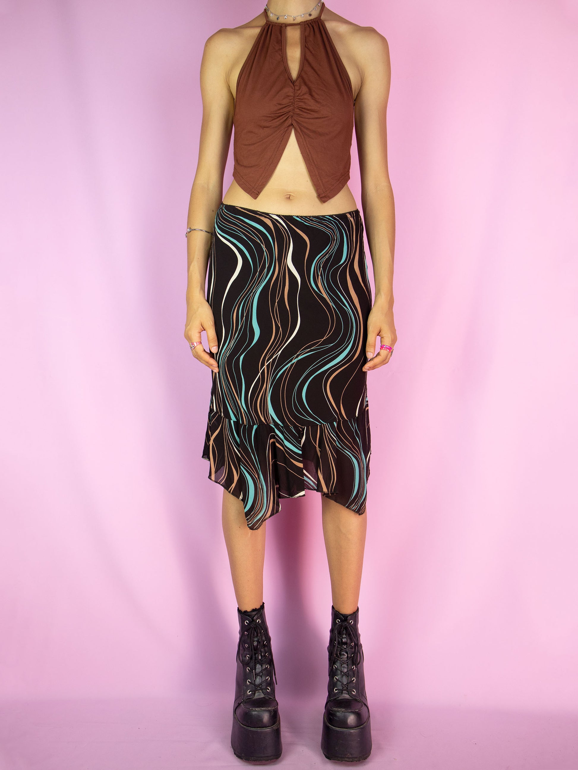 The Y2K Brown Handkerchief Mini Skirt is a vintage abstract striped printed skirt with an elasticated waist, and an asymmetrical pointed hem. Cyber fairy grunge 2000s boho summer midi skirt.