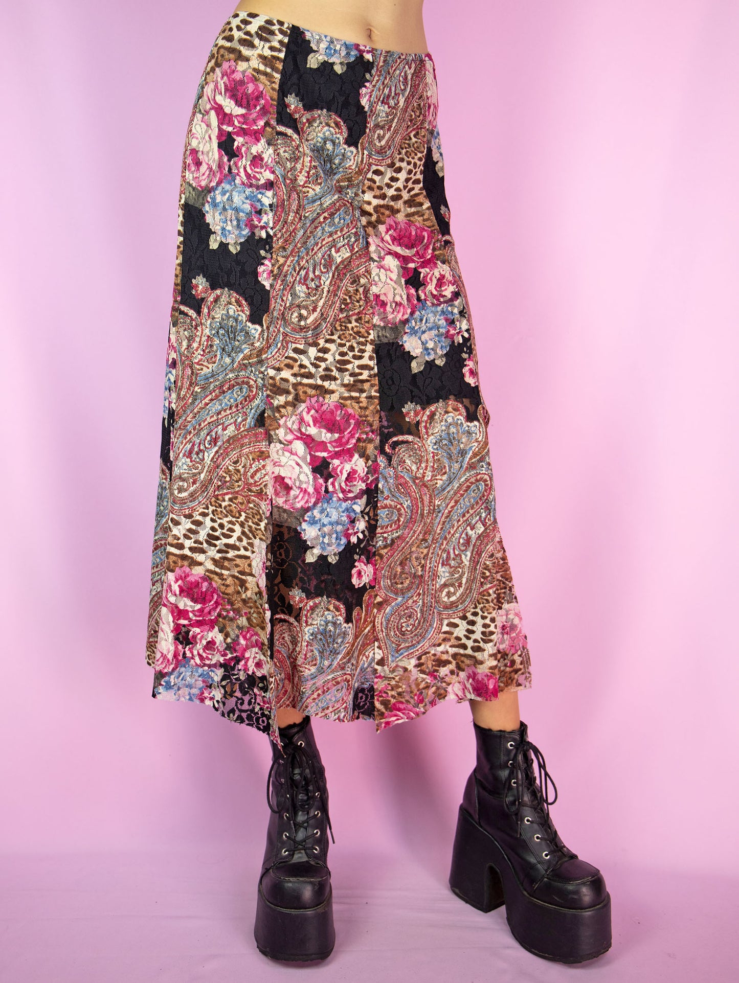 The Y2K Boho Lace Midi Skirt is a vintage floral abstract paisley animal print pattern mesh skirt with a spliced hem and an elasticated waist. Avant garde fairy grunge 2000s summer maxi skirt.