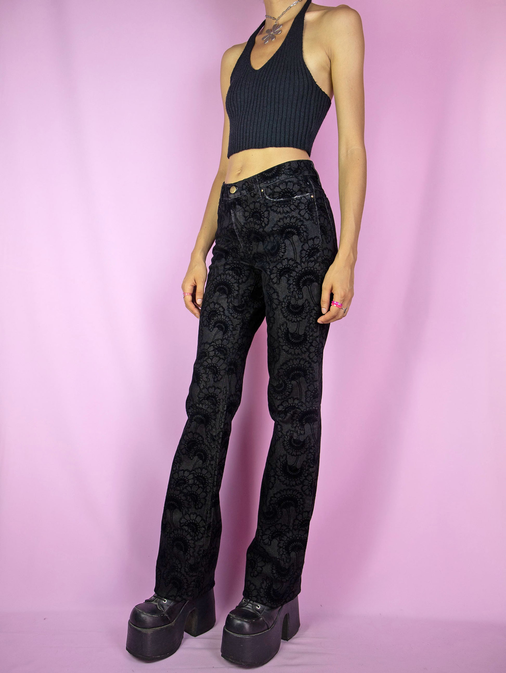 The Y2K Cavalli Black Straight Jeans are vintage 2000s mid-rise straight-leg pants, slightly stretchy adorned with floral velvet details by italian designer Roberto Cavalli. Excellent vintage condition.