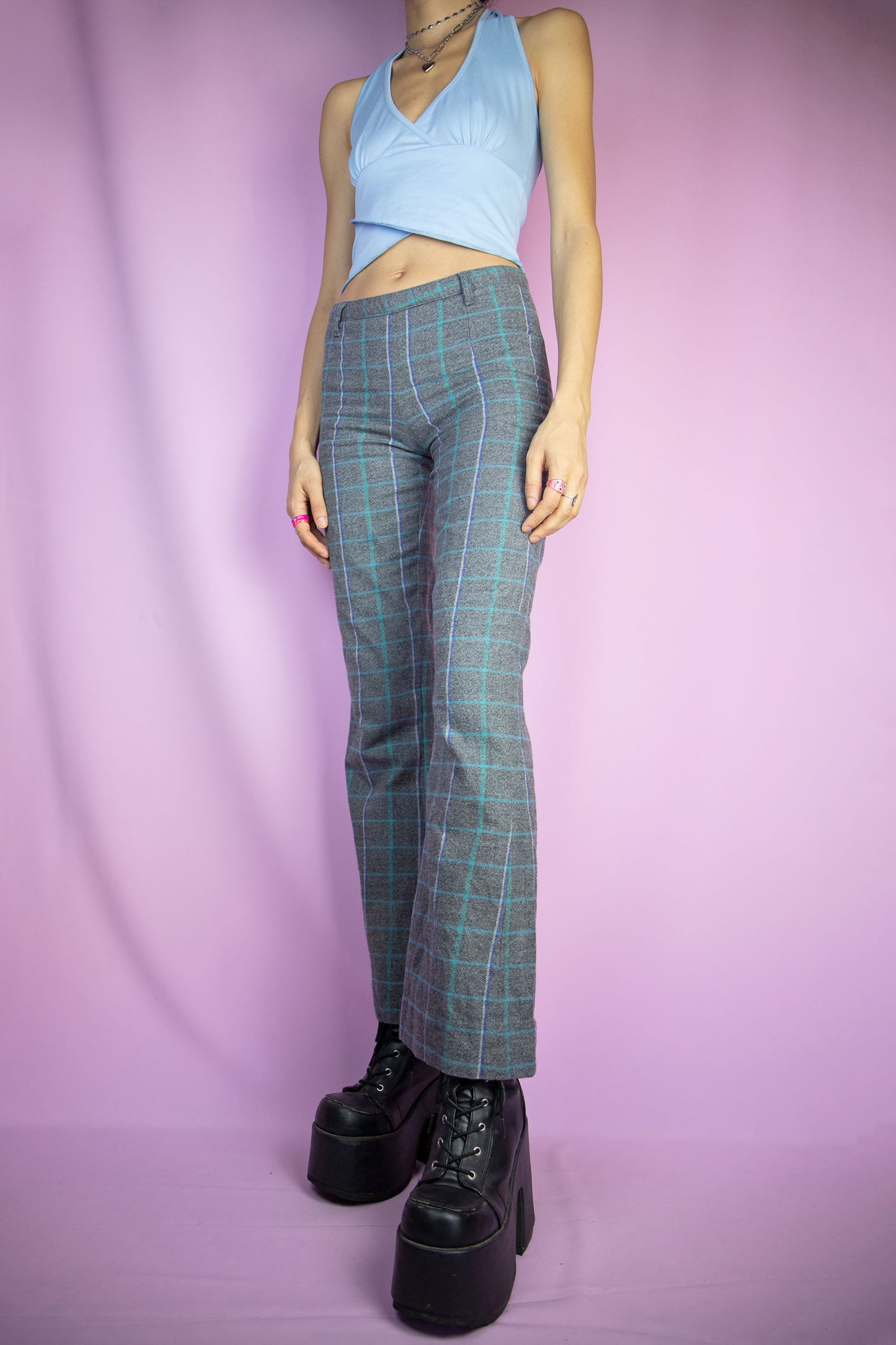 The Y2K Gray Plaid Flare Pants are vintage checkered pattern pants with a side zipper closure. Preppy office 2000s knit trousers.