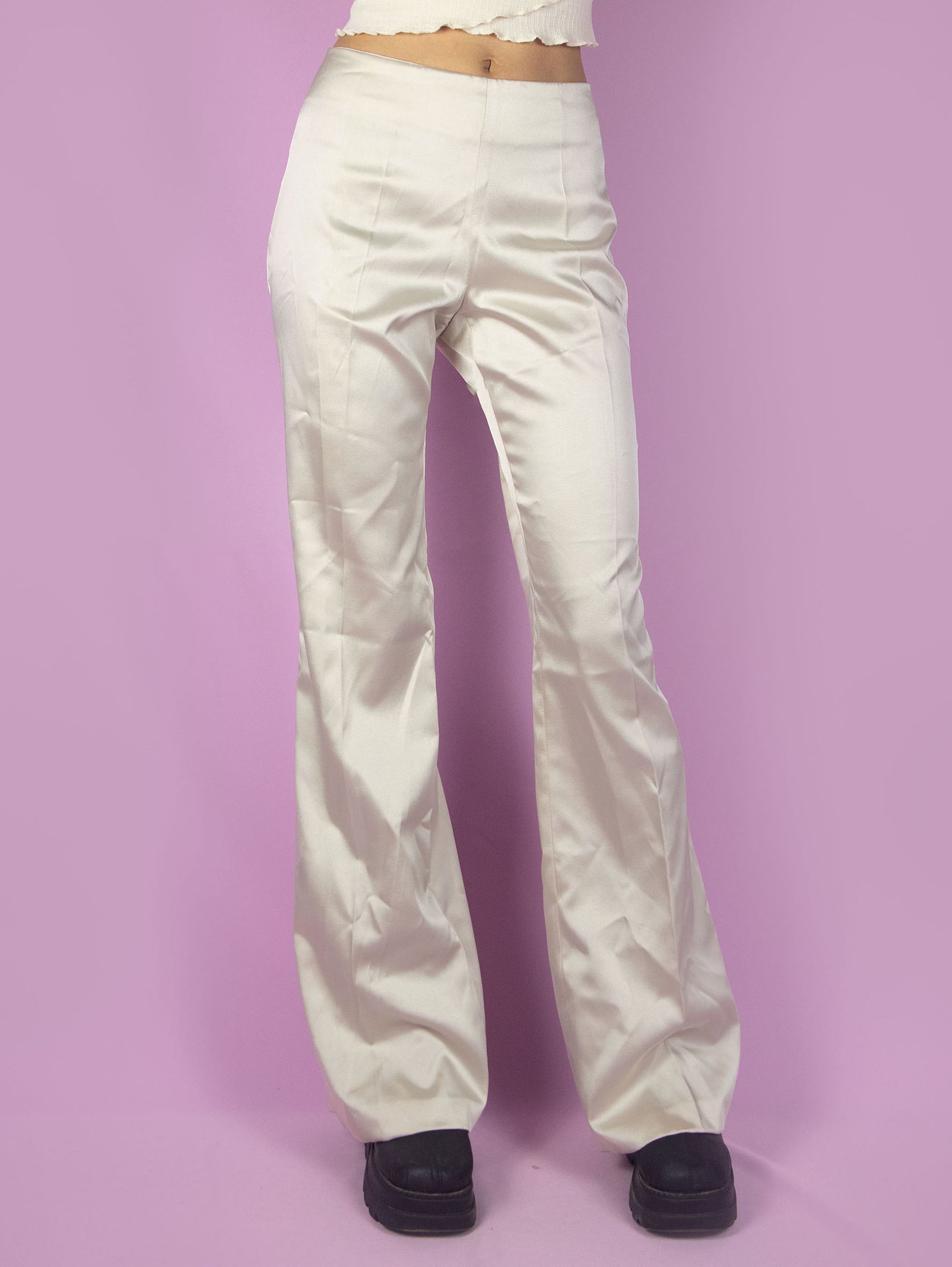The Y2K Beige Flare Pants are vintage mid-rise shiny satin trousers, slightly elastic, with a side zipper closure. Elegant 2000s evening cocktail party trousers. Made in Italy.