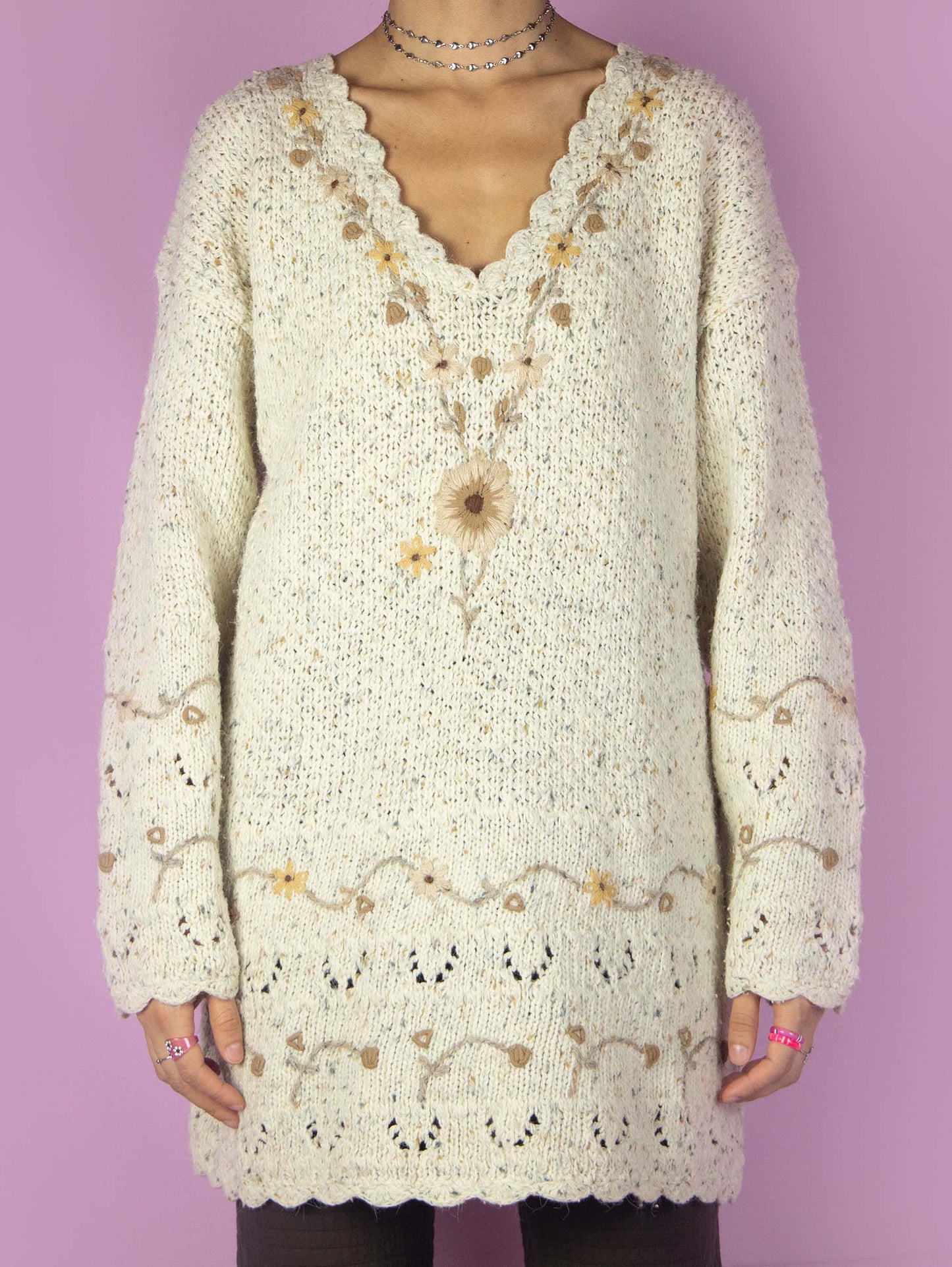The Vintage 90s Floral Knit Sweater is a long beige V-neck sweater. Boho 1990s knitted pullover.