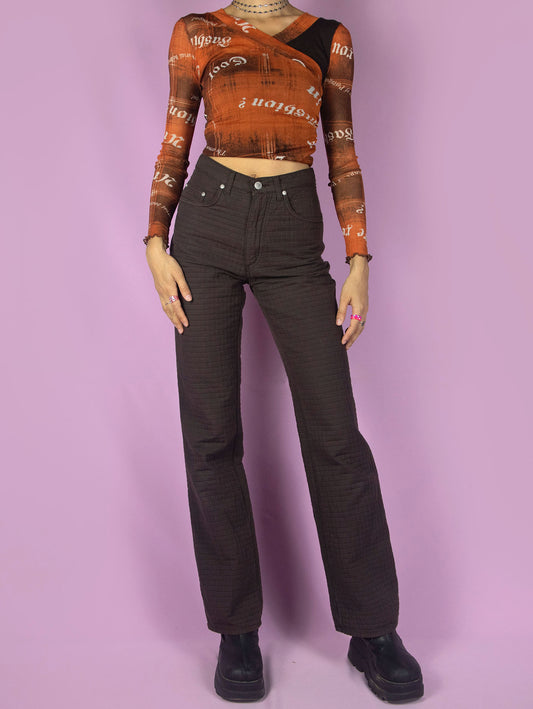 The Vintage 90s Brown Straight Leg Pants are high-waisted trousers with pockets and a front zipper closure. Made in Italy. Excellent vintage condition.