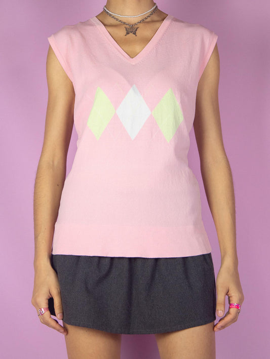 The Vintage 90s Pink Argyle Knit Top is a light pastel pink sweater vest with a geometric diamond pattern in a preppy coquette style.