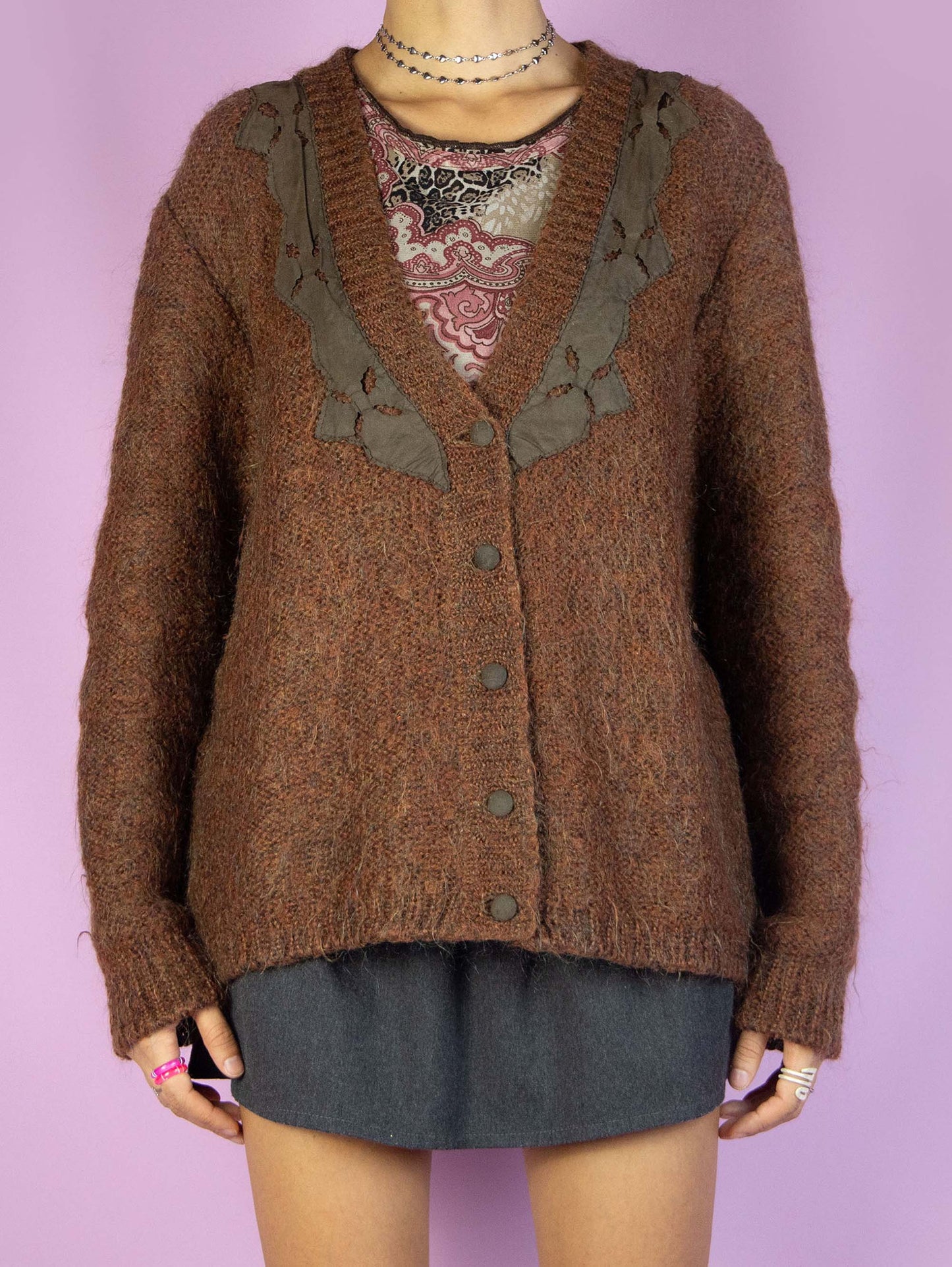 The Vintage 90s Brown Knit Cardigan is a winter V-neck cardigan sweater with buttons.