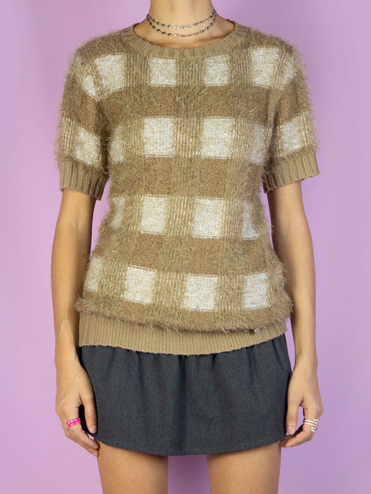 The Y2K Brown Check Knit Top is a vintage 2000s preppy style short-sleeved light brown and beige plaid fluffy knit sweater.