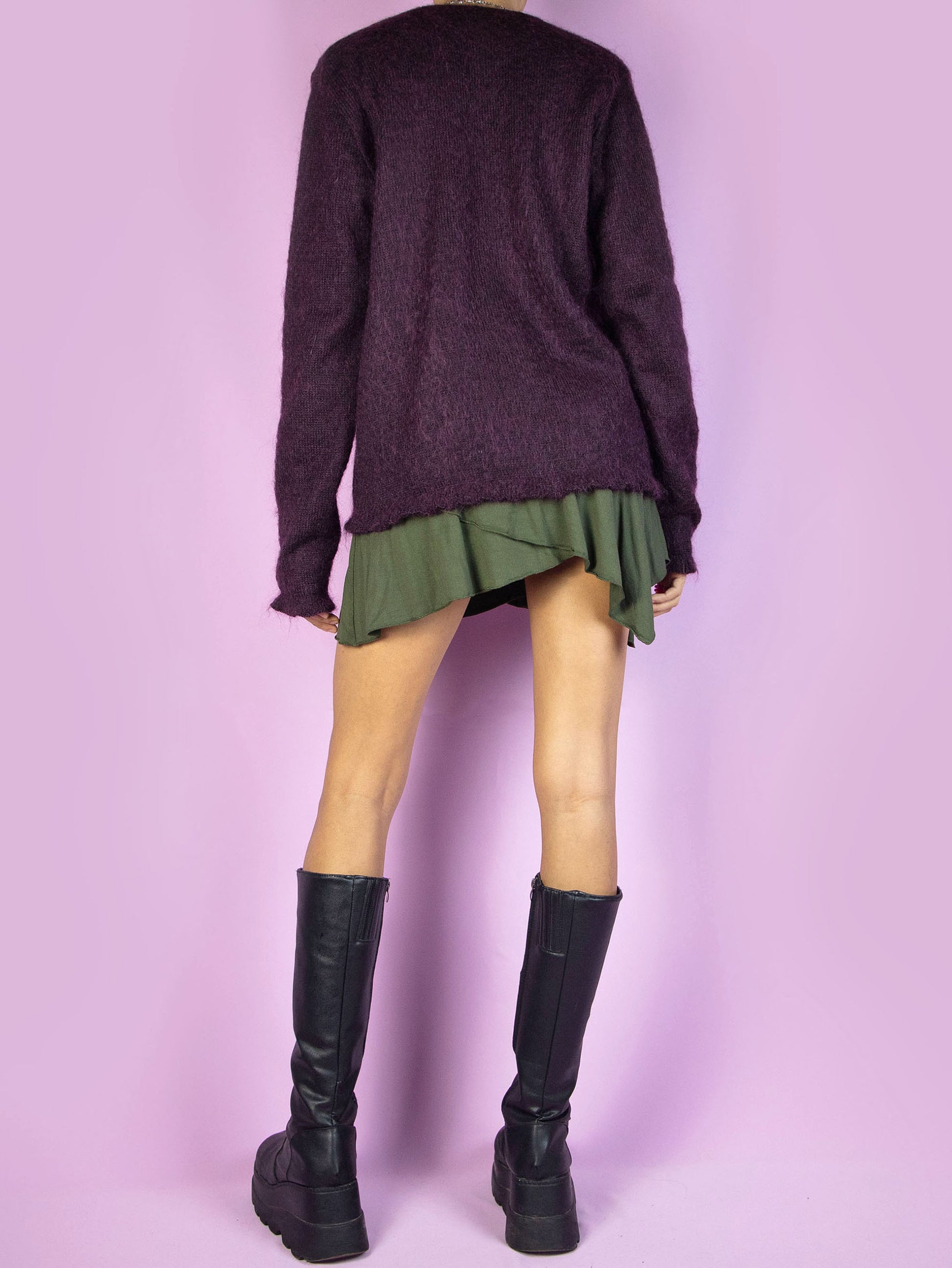 The Y2K Purple Tie Front Cardigan is a vintage 2000s dark purple mohair blend knit cardigan sweater featuring a tied front.