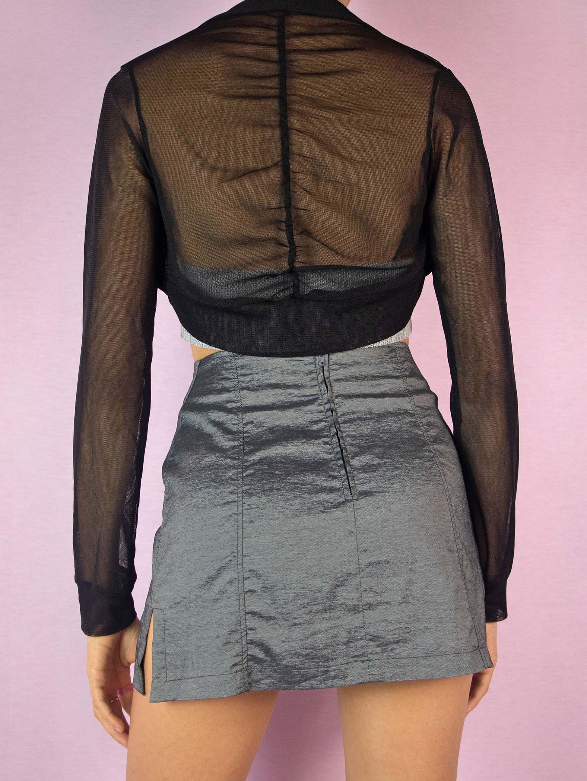 The Y2K Black Mesh Shrug Bolero is an elegant vintage 2000s long-sleeved sheer evening party jacket.
