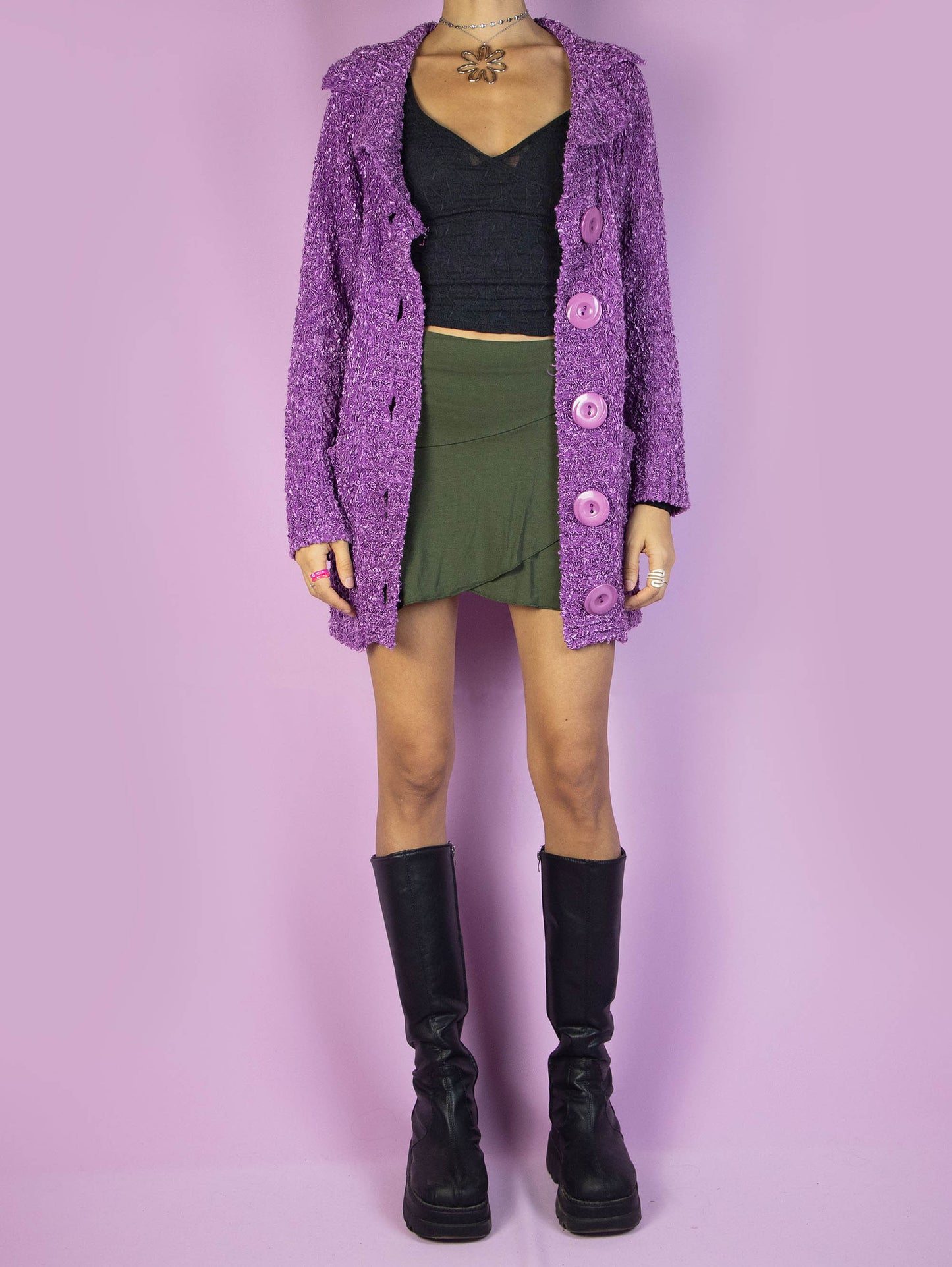 The Y2K Purple Knit Cardigan is a vintage 2000s winter chunky knit cardigan sweater with a collar, pockets, and big buttons.