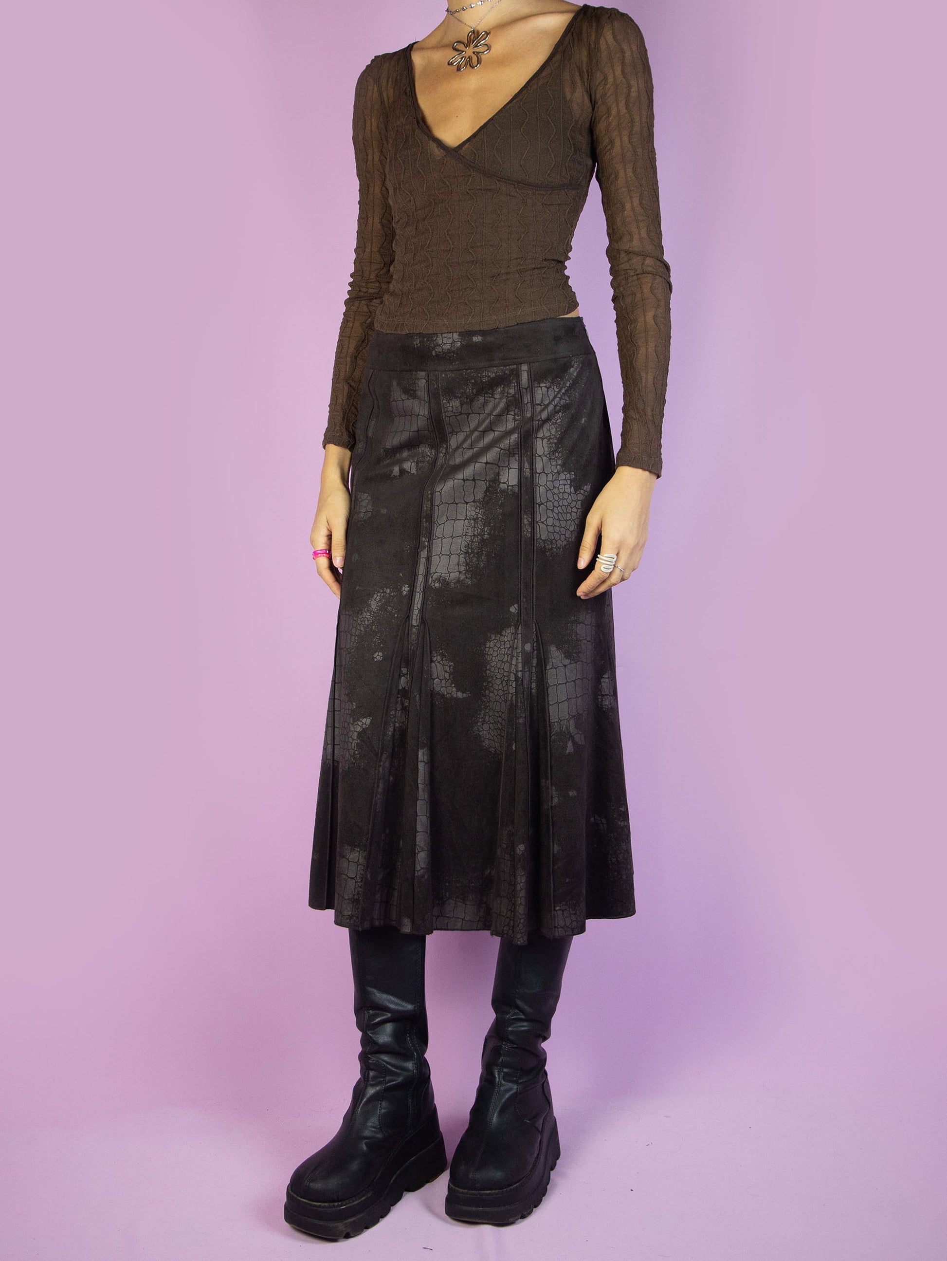The Y2K Dark Brown Midi Skirt is a vintage 2000s elegant minimalist faux suede animal print pattern trumpet maxi skirt with a side zipper closure. Excellent vintage condition.