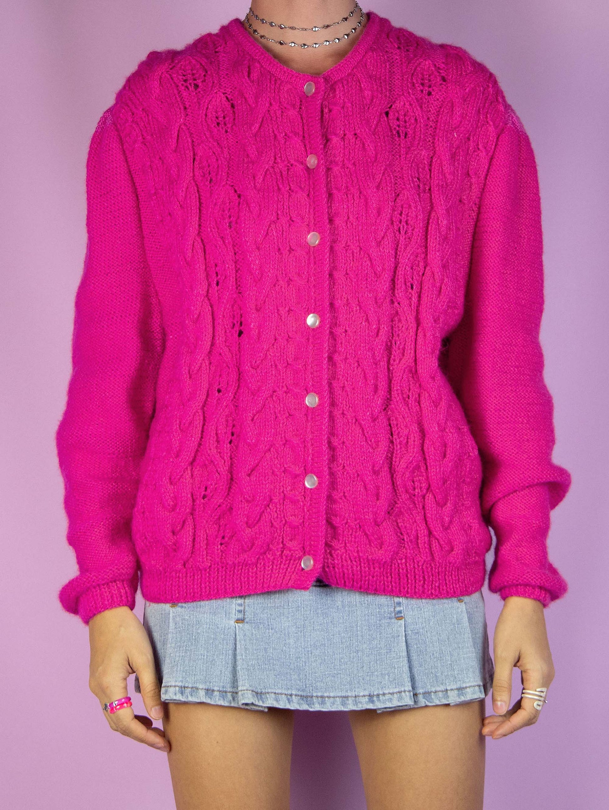 The Vintage 90s Romantic Pink Cardigan is a winter fuchsia hot pink cardigan sweater with cable-knit front, puff sleeve and buttons.