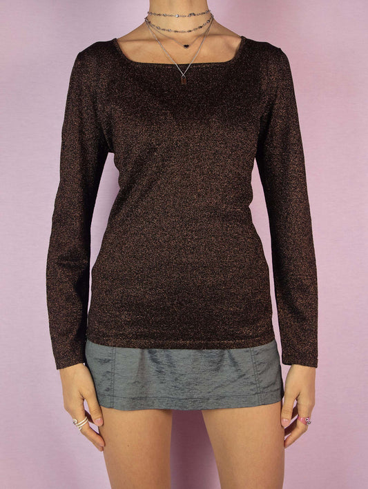 The Vintage 90s Black Brown Glitter Top is a shiny sparkle long-sleeved shirt perfect for a night out. Made in Italy.