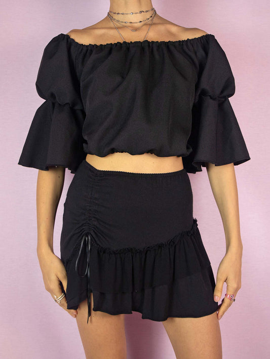 The Y2K Black Bell Sleeve Crop Top is a vintage 2000s romantic fairy goth cottage-style off-the-shoulder top with elastic at the waist.