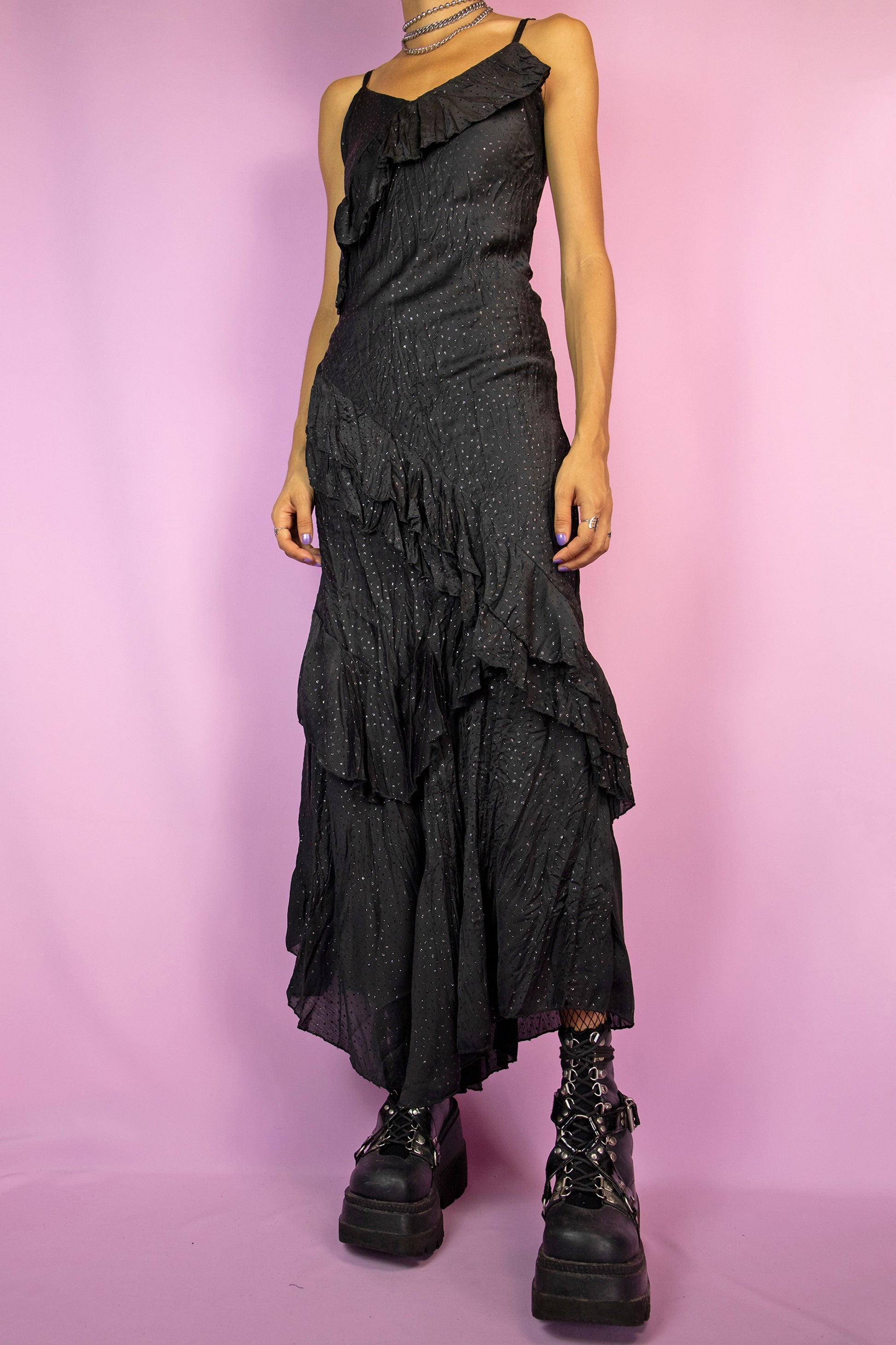 The Vintage 90s Black Ruffle Maxi Dress is a black dress with asymmetrical hem, glitter polka dots and ruffles. Elegant 1990s party midi dress.