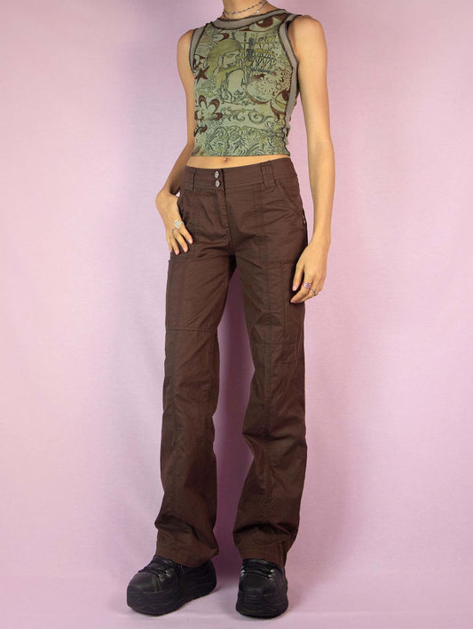 The Y2K Brown Low Rise Pants are vintage 2000s cyber grunge cargo-style wide straight pants with pockets and zipper closure.