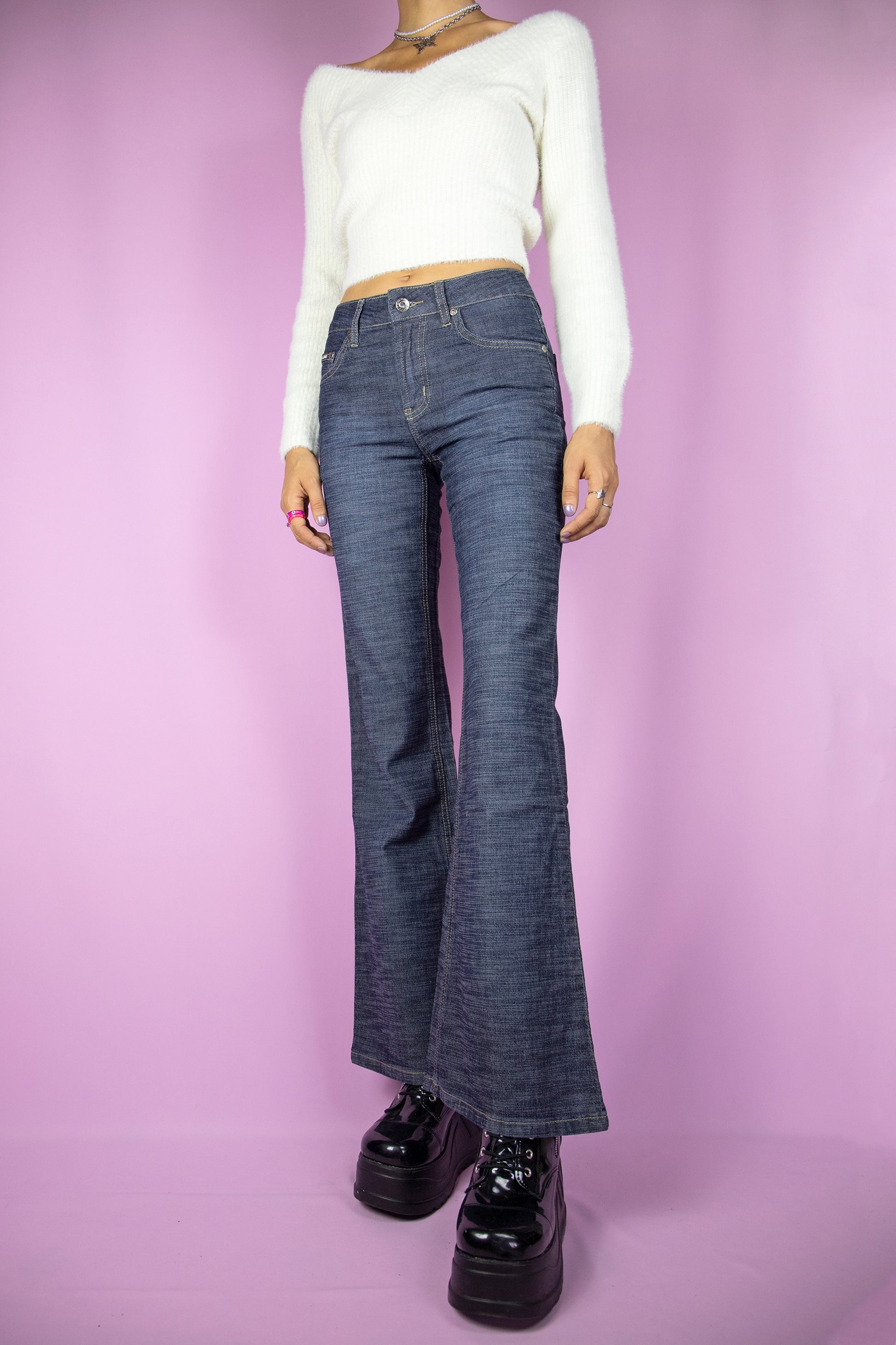 The Y2K Dark Denim Flare Jeans are vintage wide pants with pockets. Cyber grunge 2000s jeans.