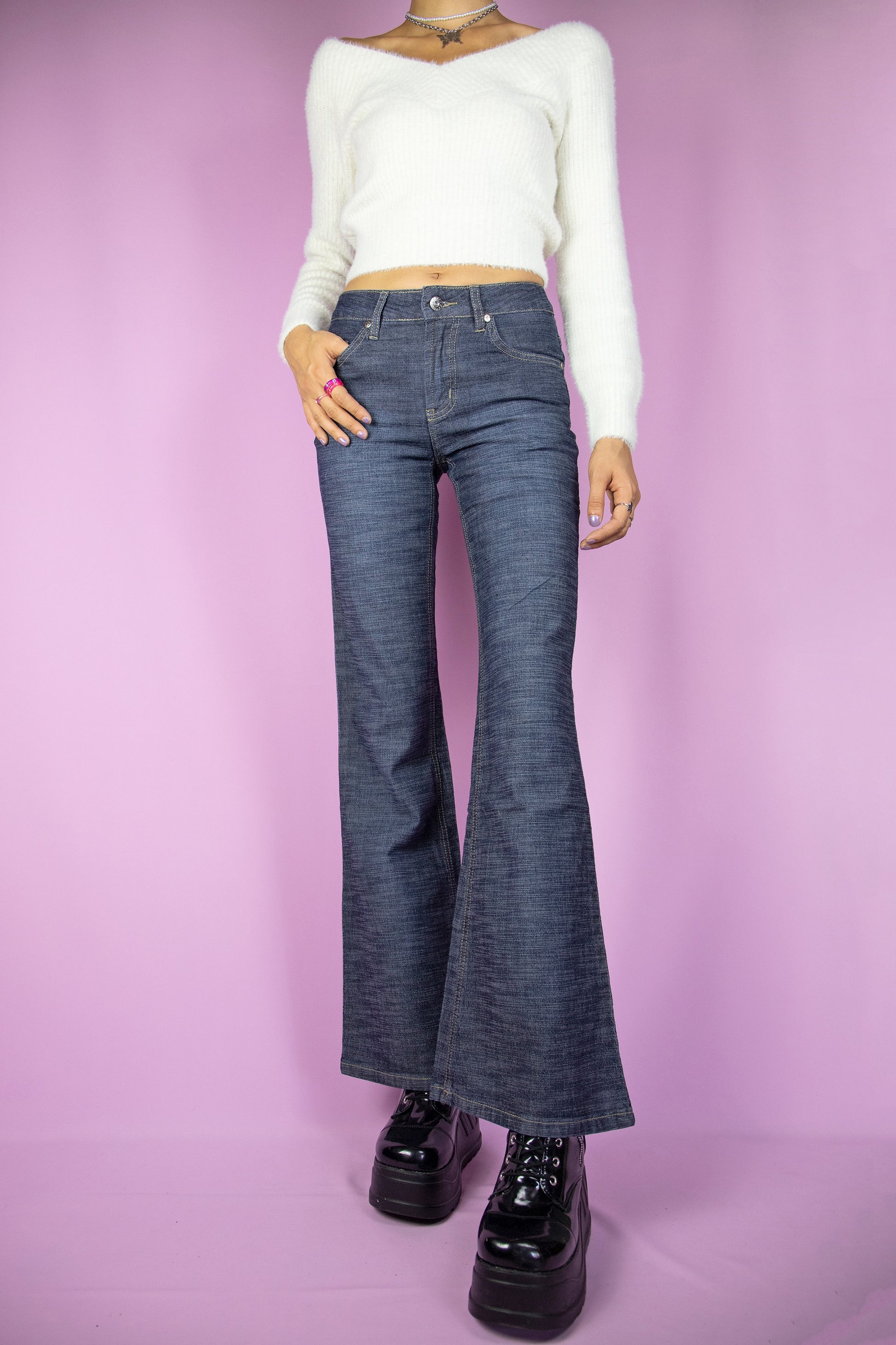 The Y2K Dark Denim Flare Jeans are vintage wide pants with pockets. Cyber grunge 2000s jeans.