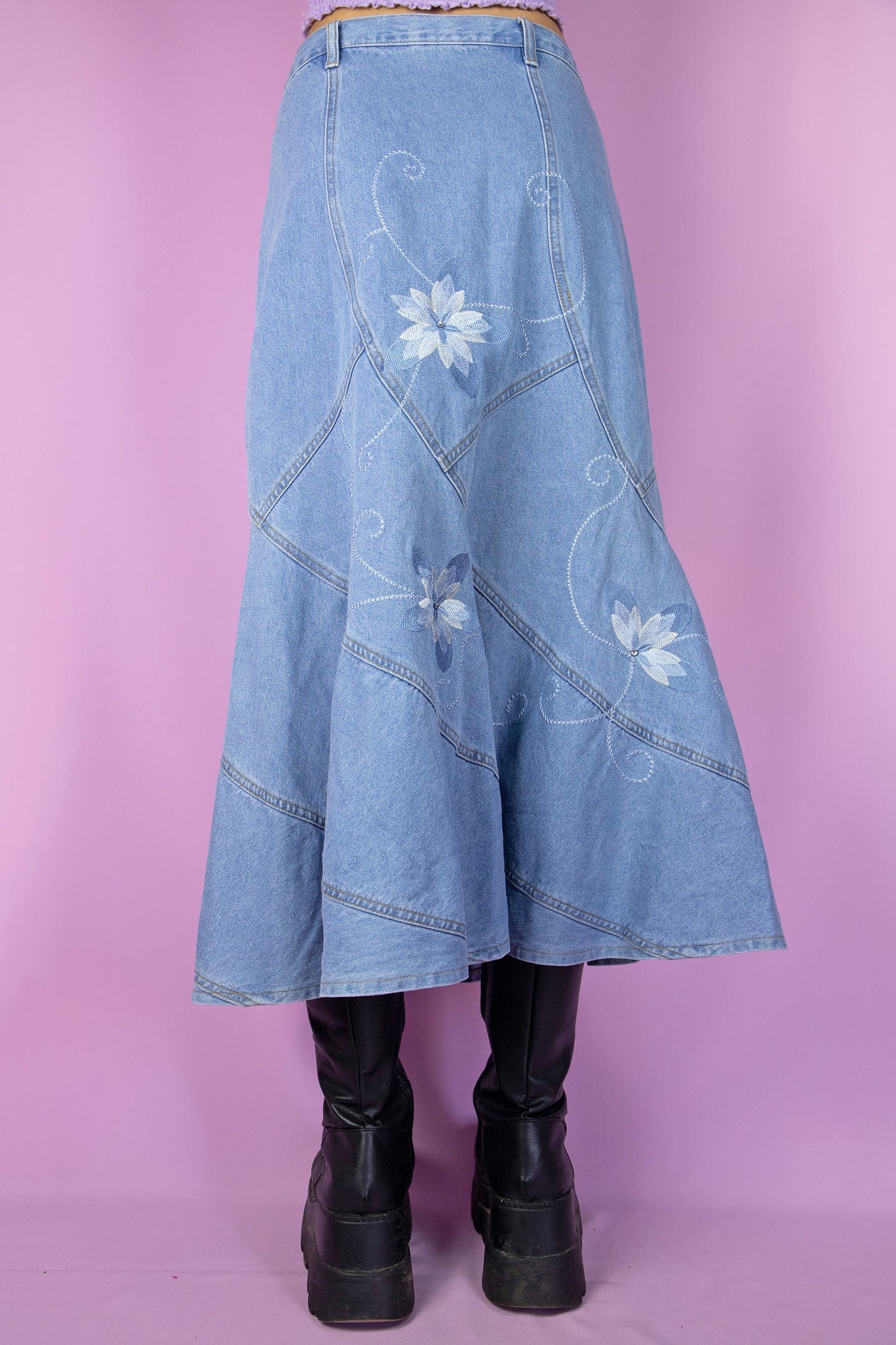 The Y2K Denim Trumpet Midi Skirt is a vintage skirt adorned with embroidered floral details. Cyber grunge 2000s jean maxi skirt.