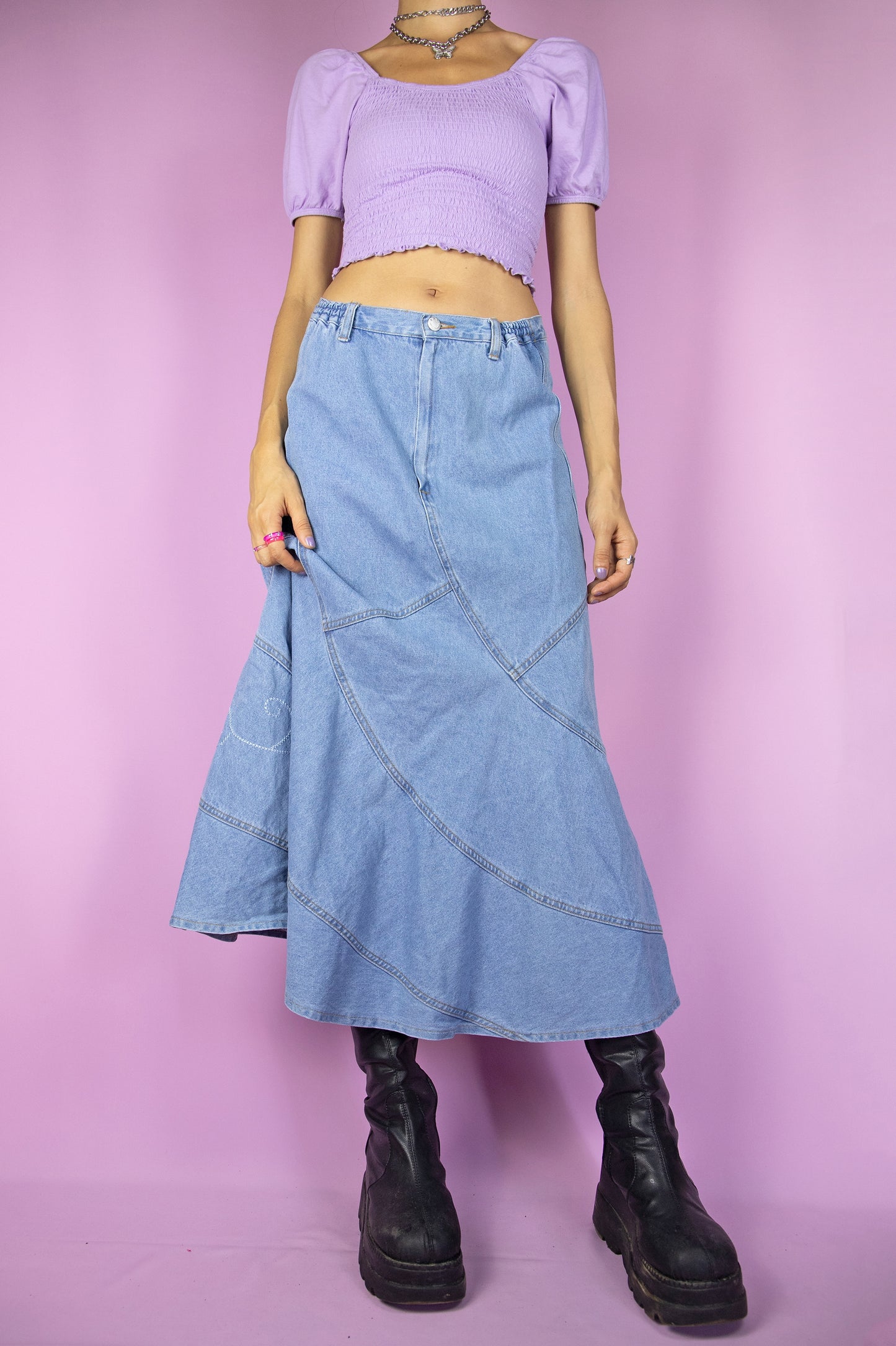 The Y2K Denim Trumpet Midi Skirt is a vintage skirt adorned with embroidered floral details. Cyber grunge 2000s jean maxi skirt.