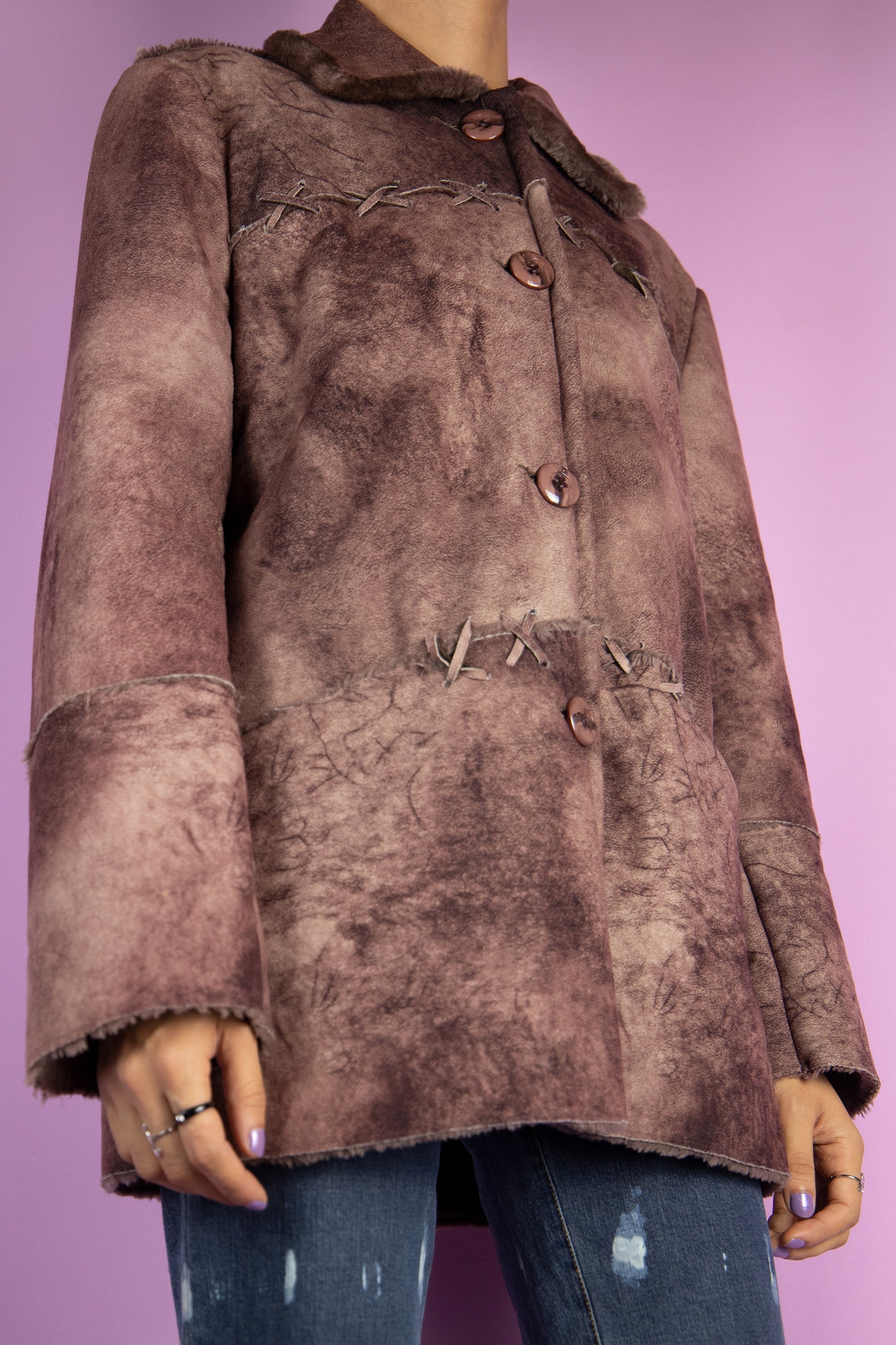 The Y2K Printed Faux Fur Jacket is a vintage 2000s winter brown abstract tie-dye pattern statement coat with a collar, pockets, and buttons.
