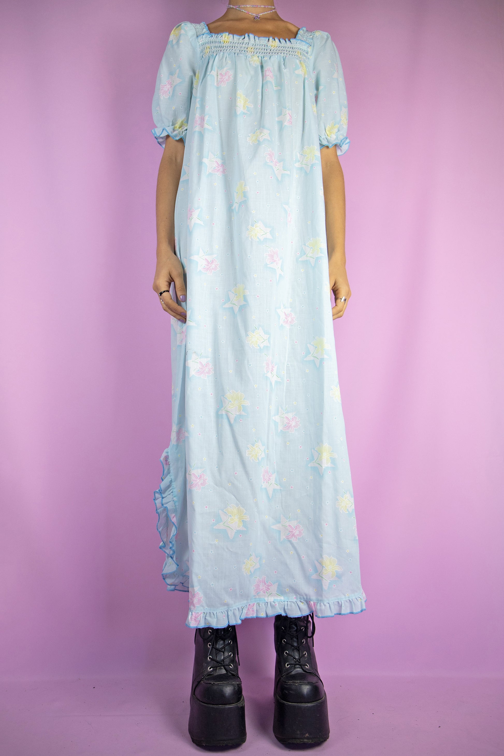 The Vintage 80s Blue Floral Nightgown Dress is a pastel light blue floral maxi dress with shirred front, short puff sleeves, side slits and ruffle details. Gorgeous romantic sleepwear 1980s night dress.