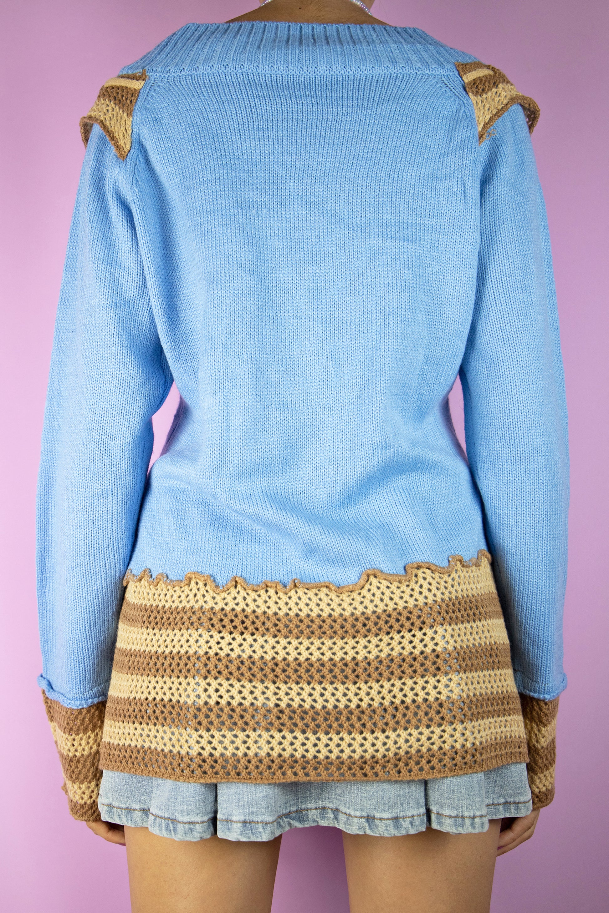 The Y2K Fairy Asymmetric Knit Sweater is a vintage 2000s boho grunge style blue pullover with brown and beige crochet details.