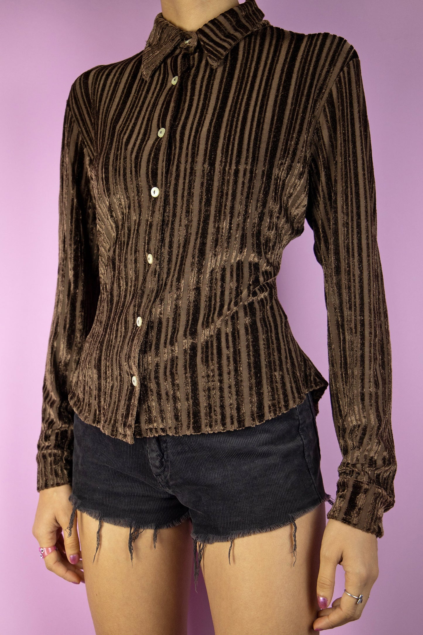 The Vintage 90's Brown Velvet Shirt is a striped stretch dark brown velvet top. This cute boho grunge dark academia blouse is from the 1990s.