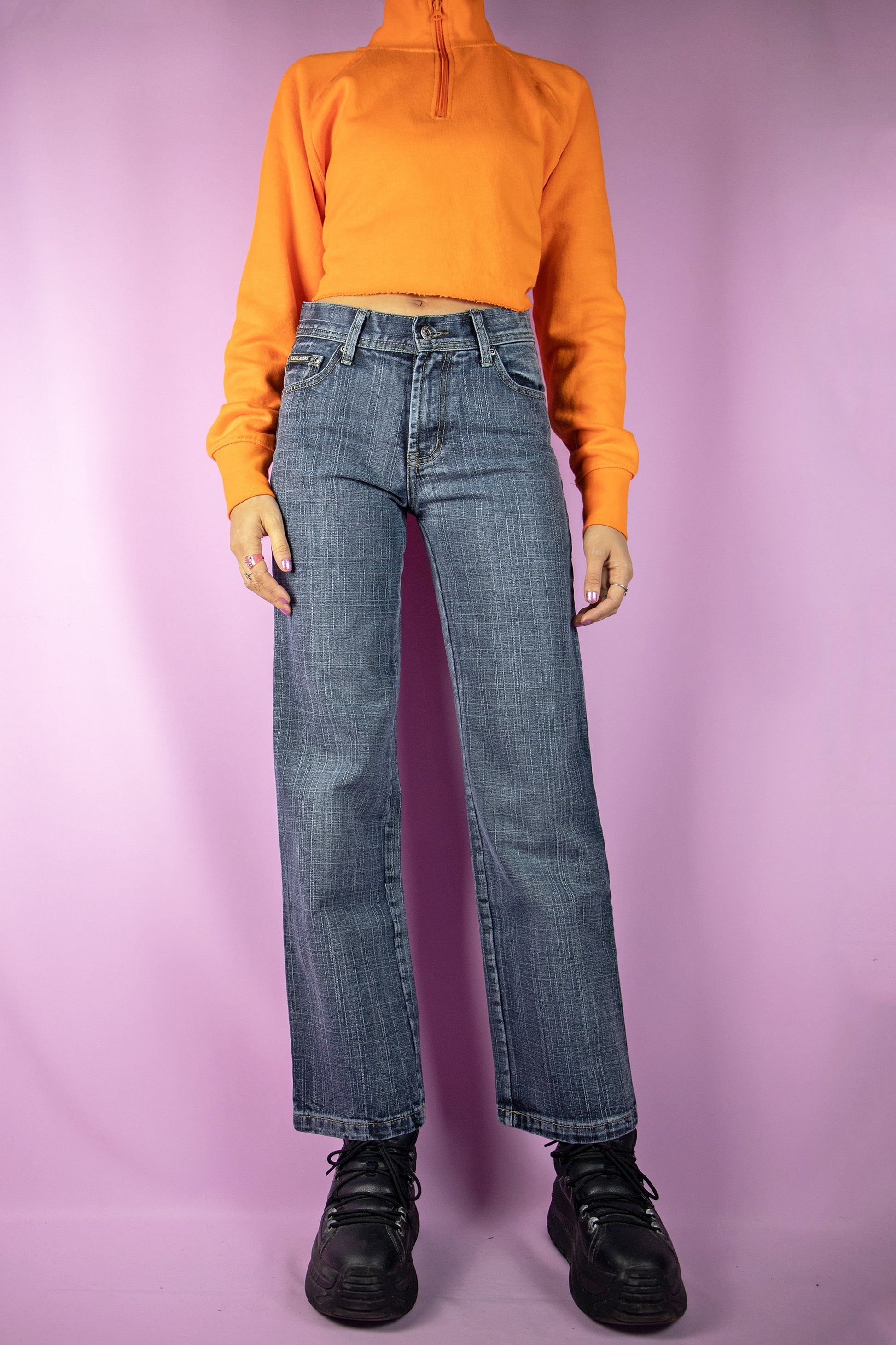 The Y2K Mid Rise Wide Jeans are dark wash mid-rise wide-leg pants. Cyber grunge gorpcore 2000s denim trousers.